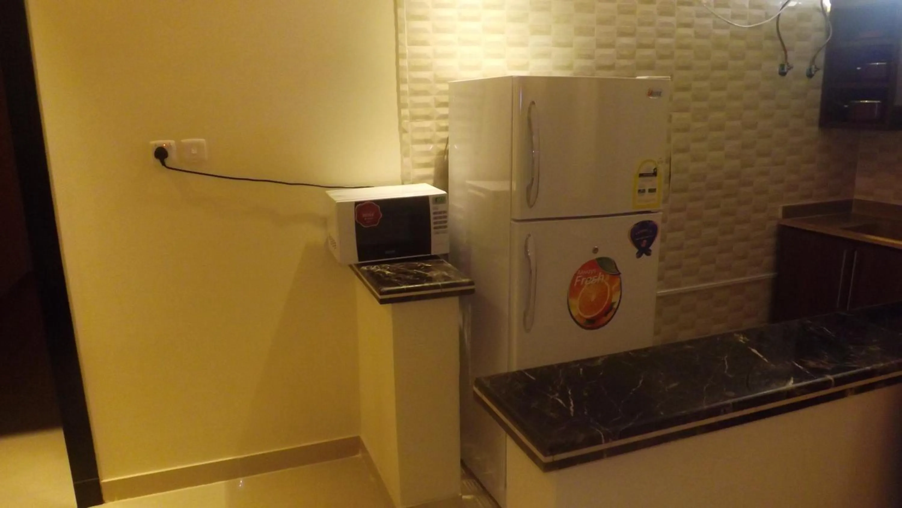 Kitchen or kitchenette in Taleen Serviced Apartments AlMasif