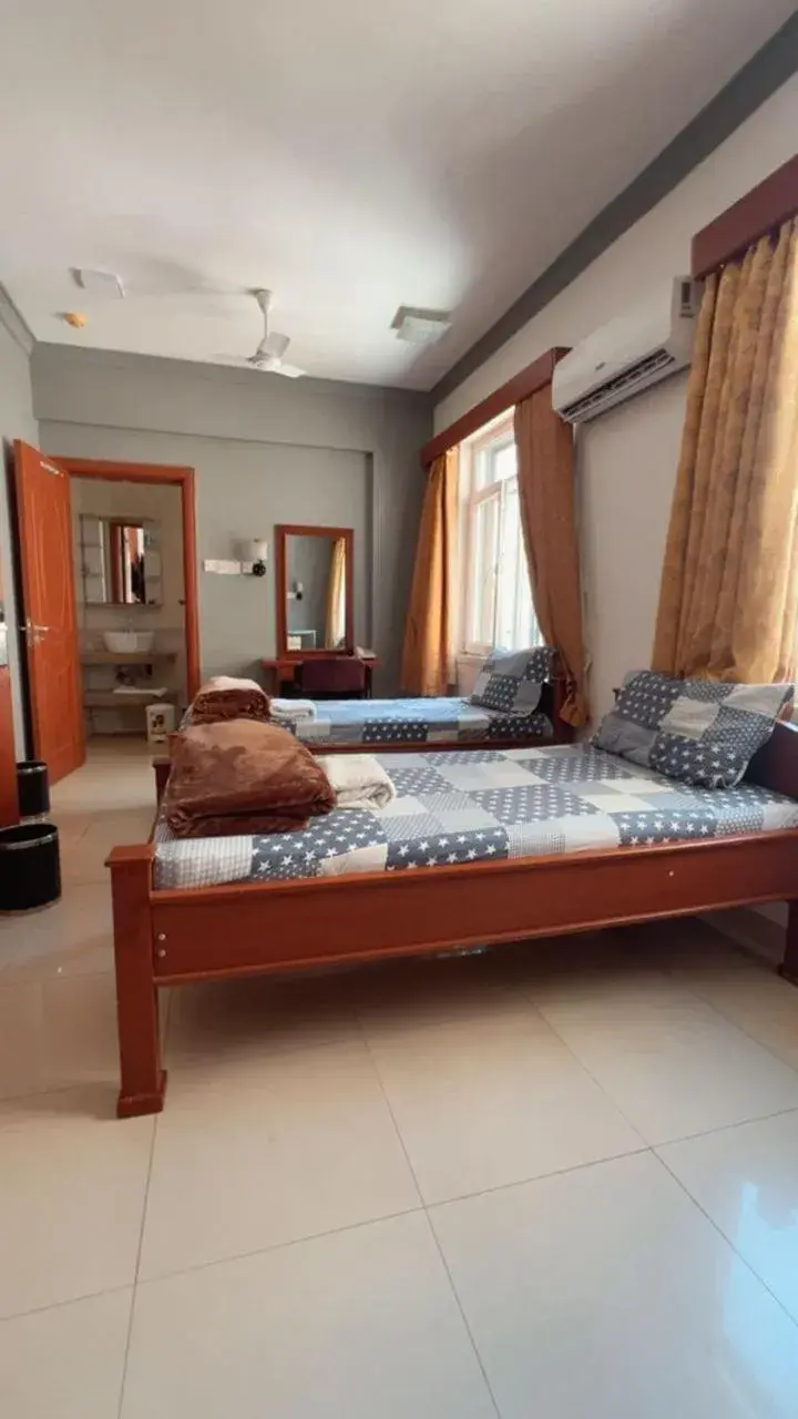 Bed in Rainbow Hotel Bed in Rainbow Hotel