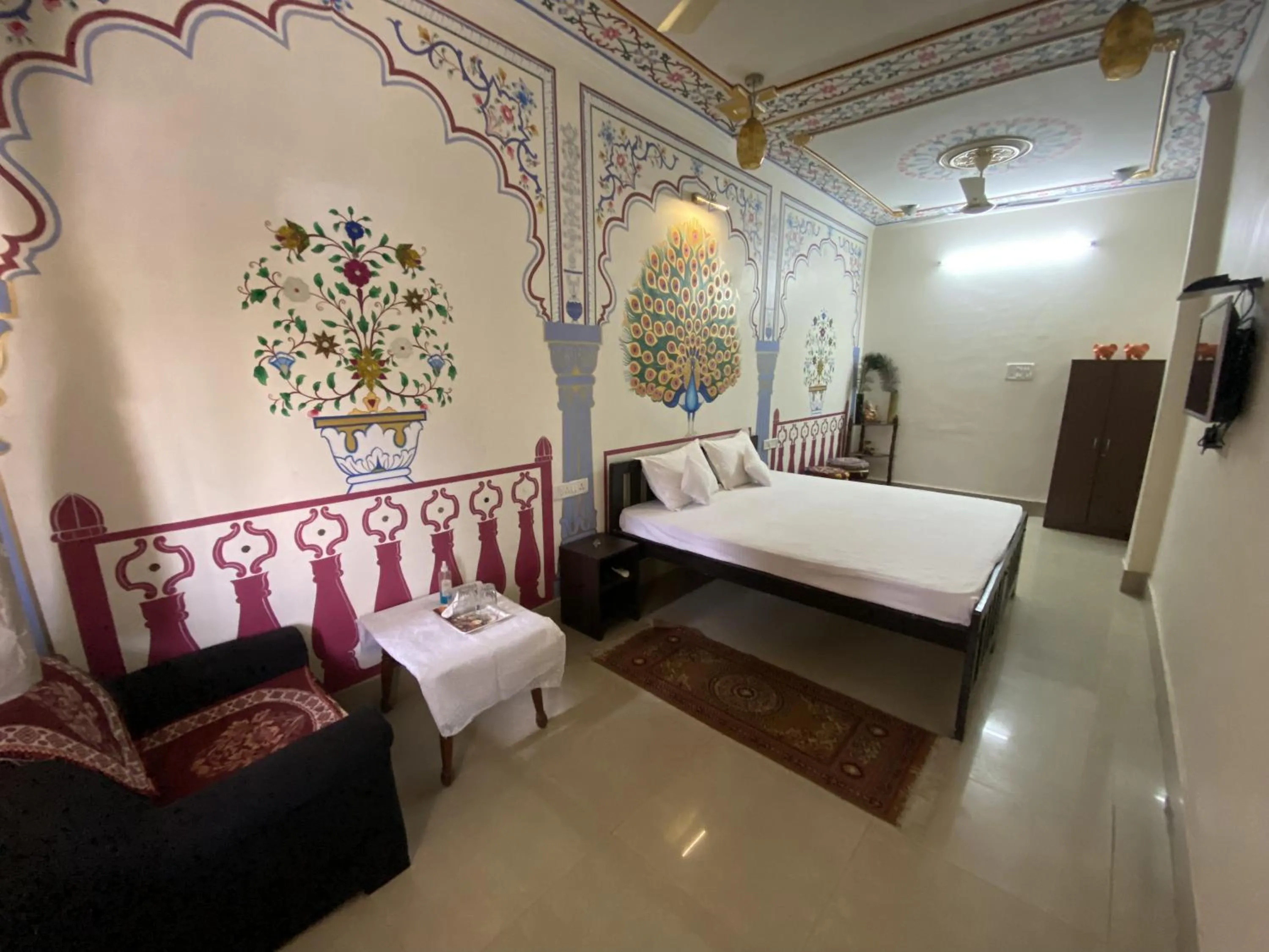 Bed in Golden Peacock Heritage Home Stay