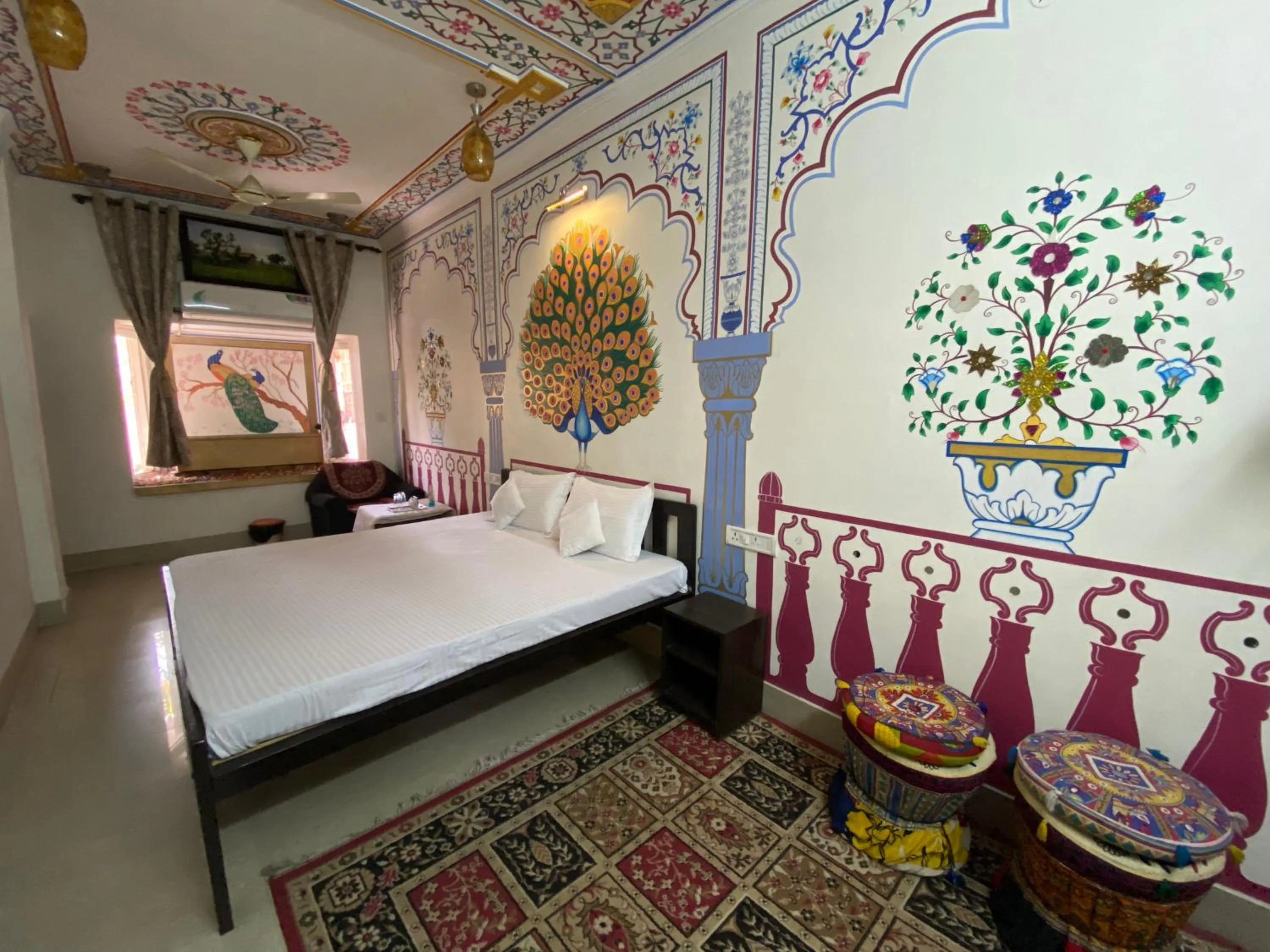 Bed in Golden Peacock Heritage Home Stay