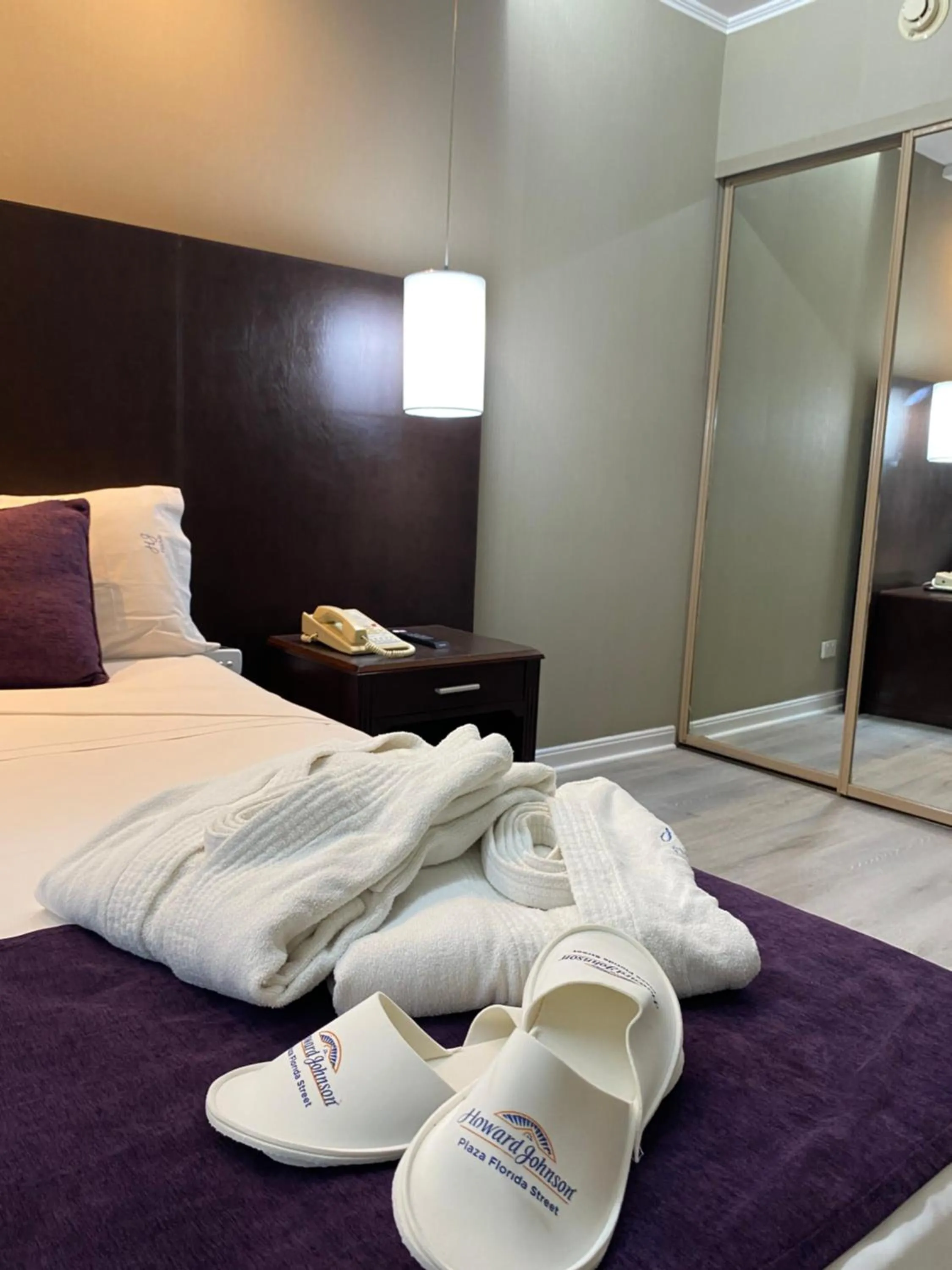 towels, Bed in Howard Johnson Plaza by Wyndham Buenos Aires Florida Street