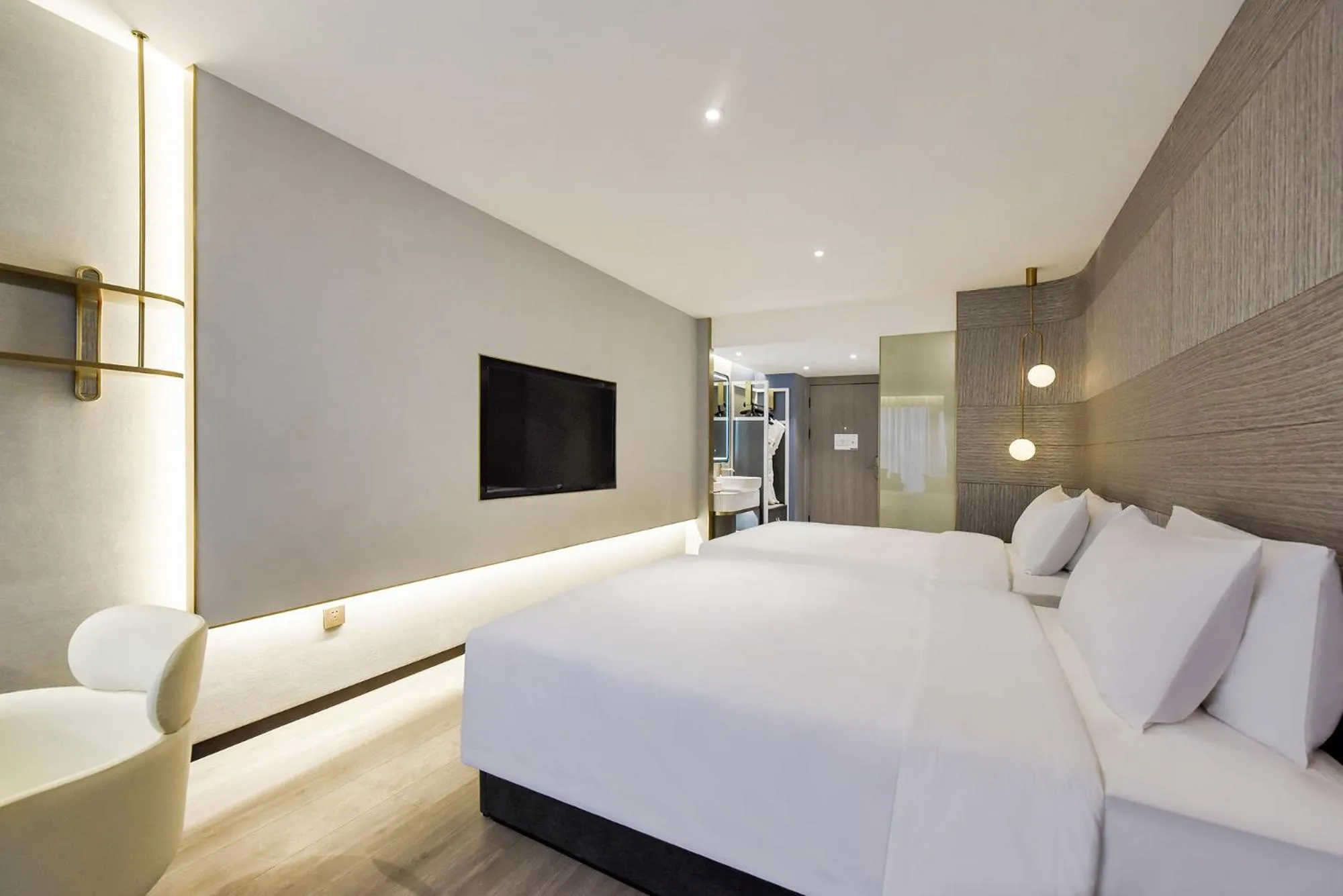 Bed in Kuanrong Suites Hotel Liangjiang love sea shopping park