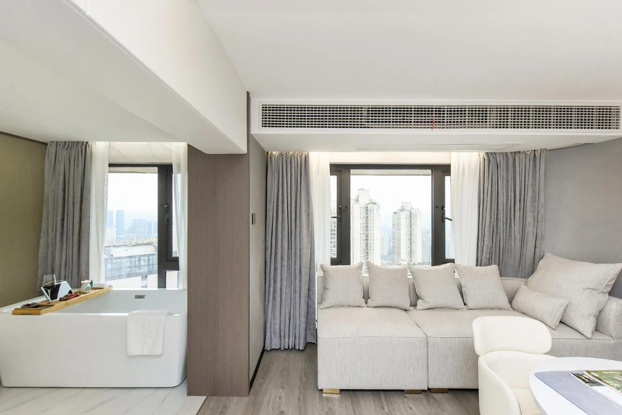 Living room, Bed in Kuanrong Suites Hotel Liangjiang love sea shopping park