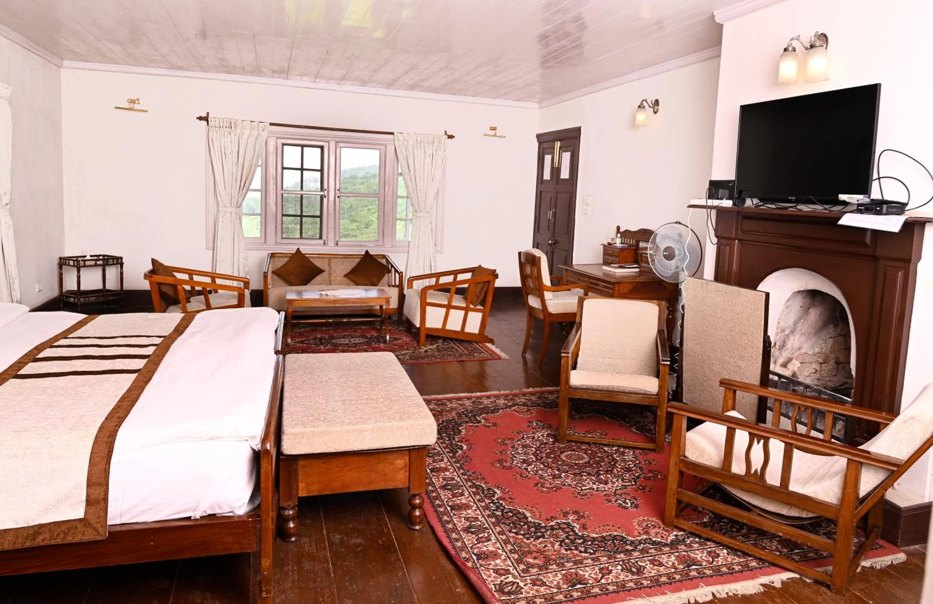 Seating area, Bed in Tumsong Tea Retreat