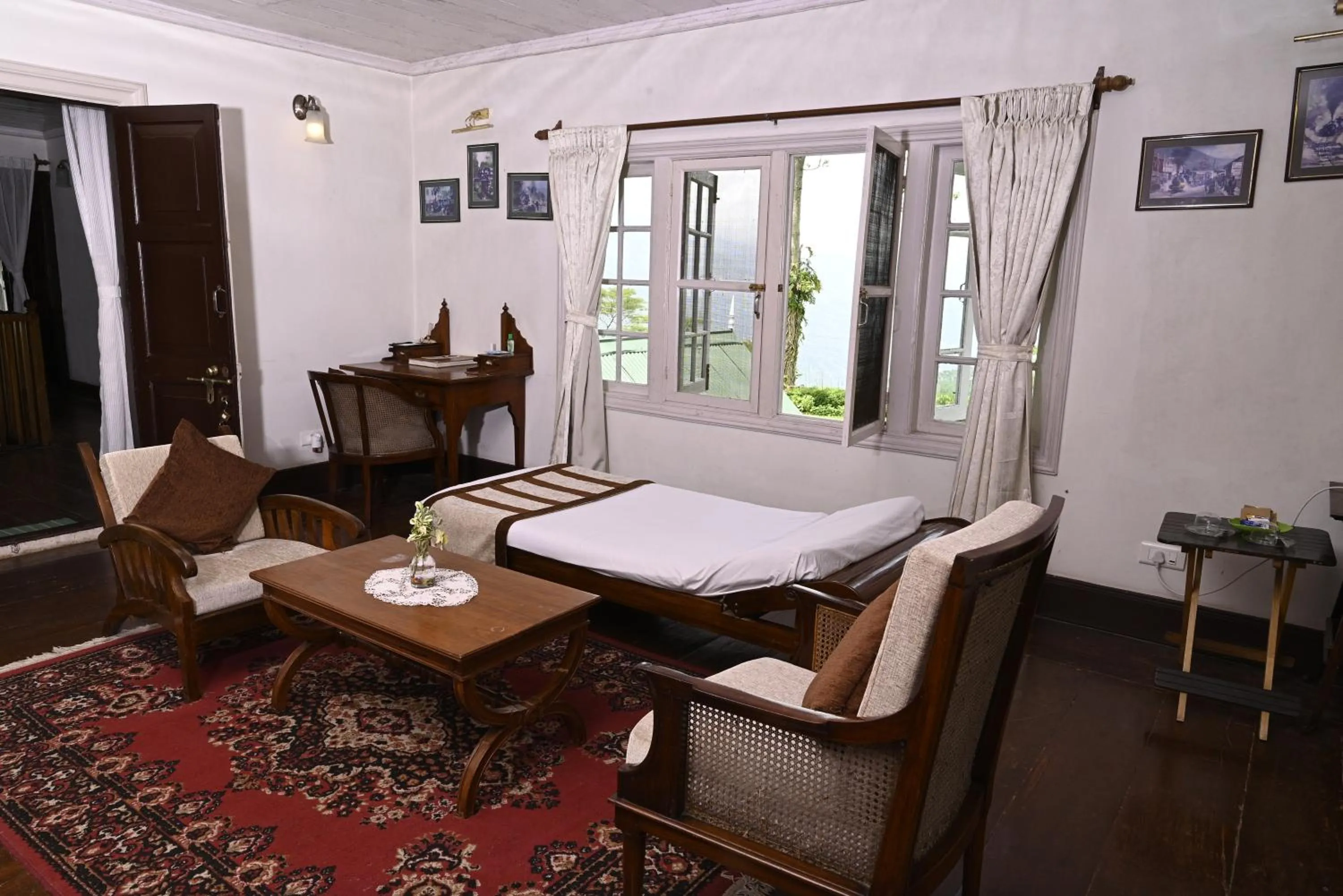 Seating area, Bed in Tumsong Tea Retreat