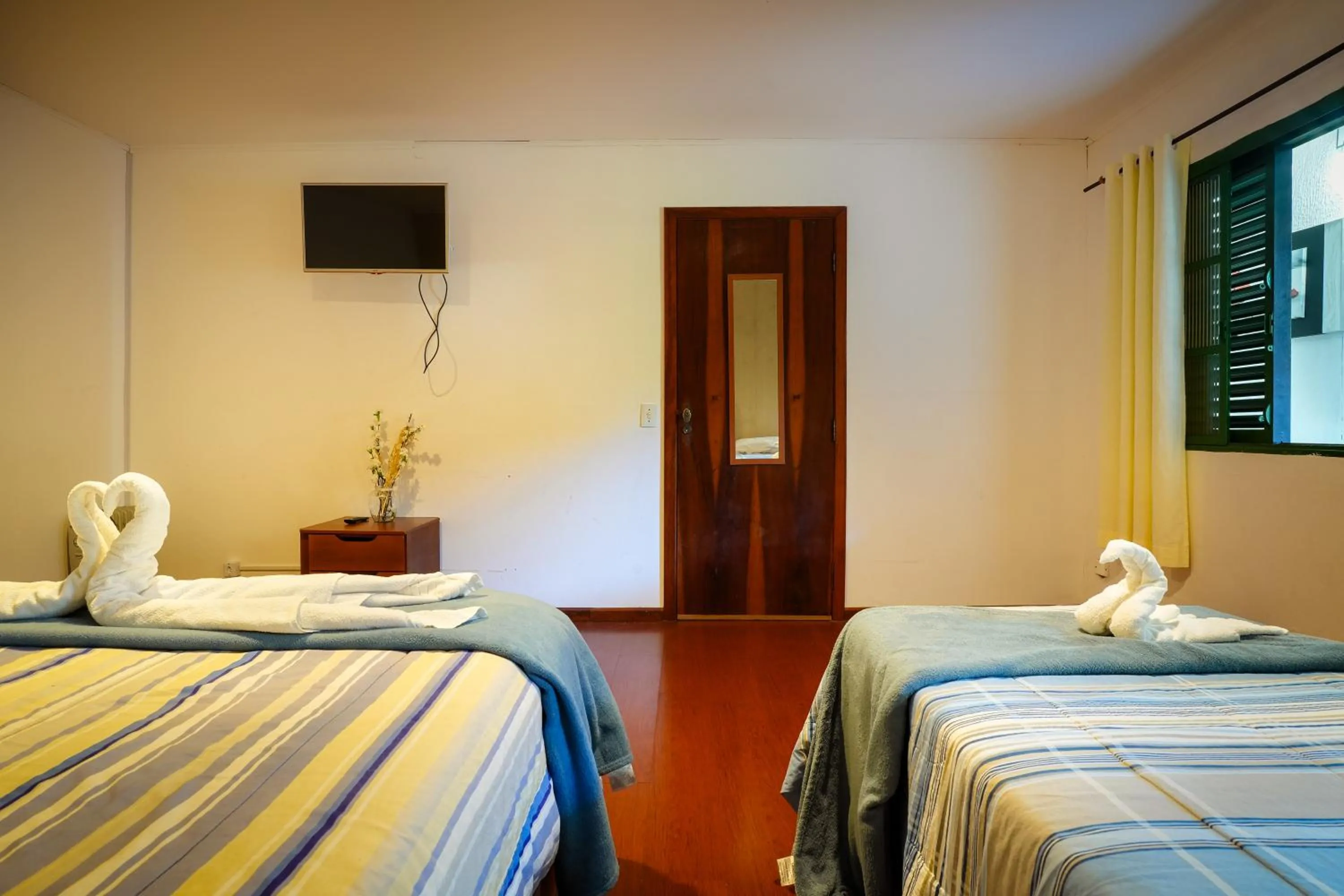 Bed in VELINN Pousada Flores do Capivari