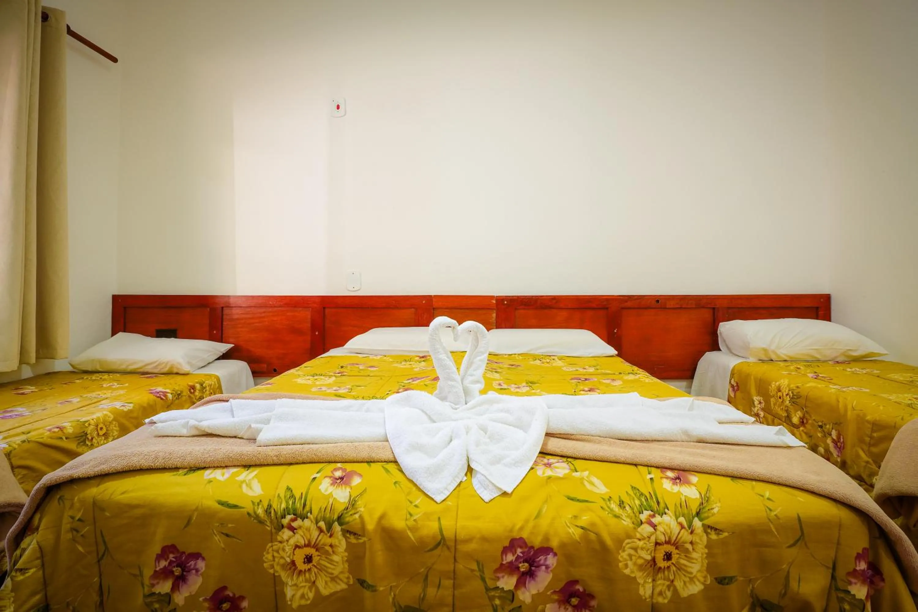 Bed in VELINN Pousada Flores do Capivari