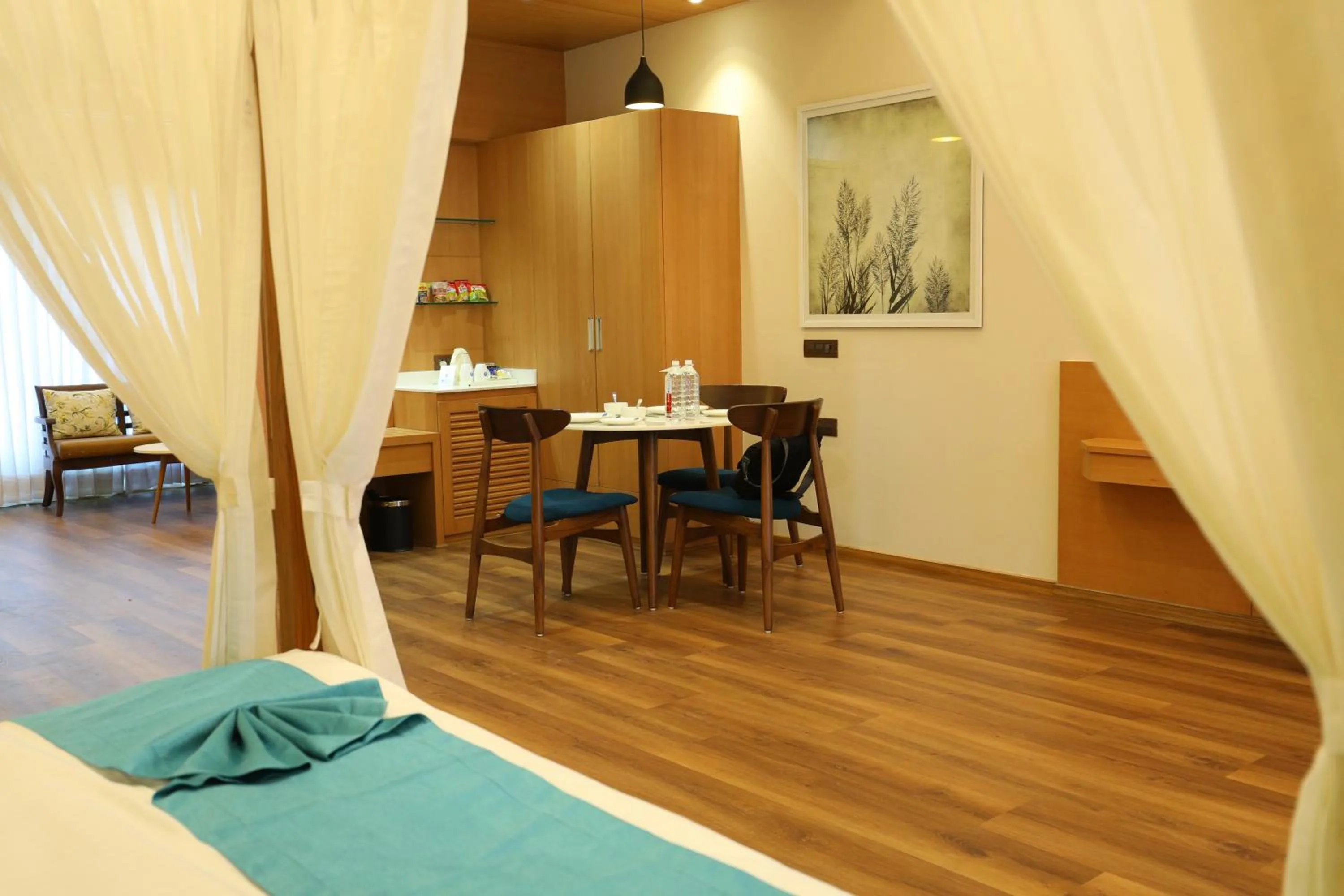 Dining area, Bed in Hotel Blueivy Anand