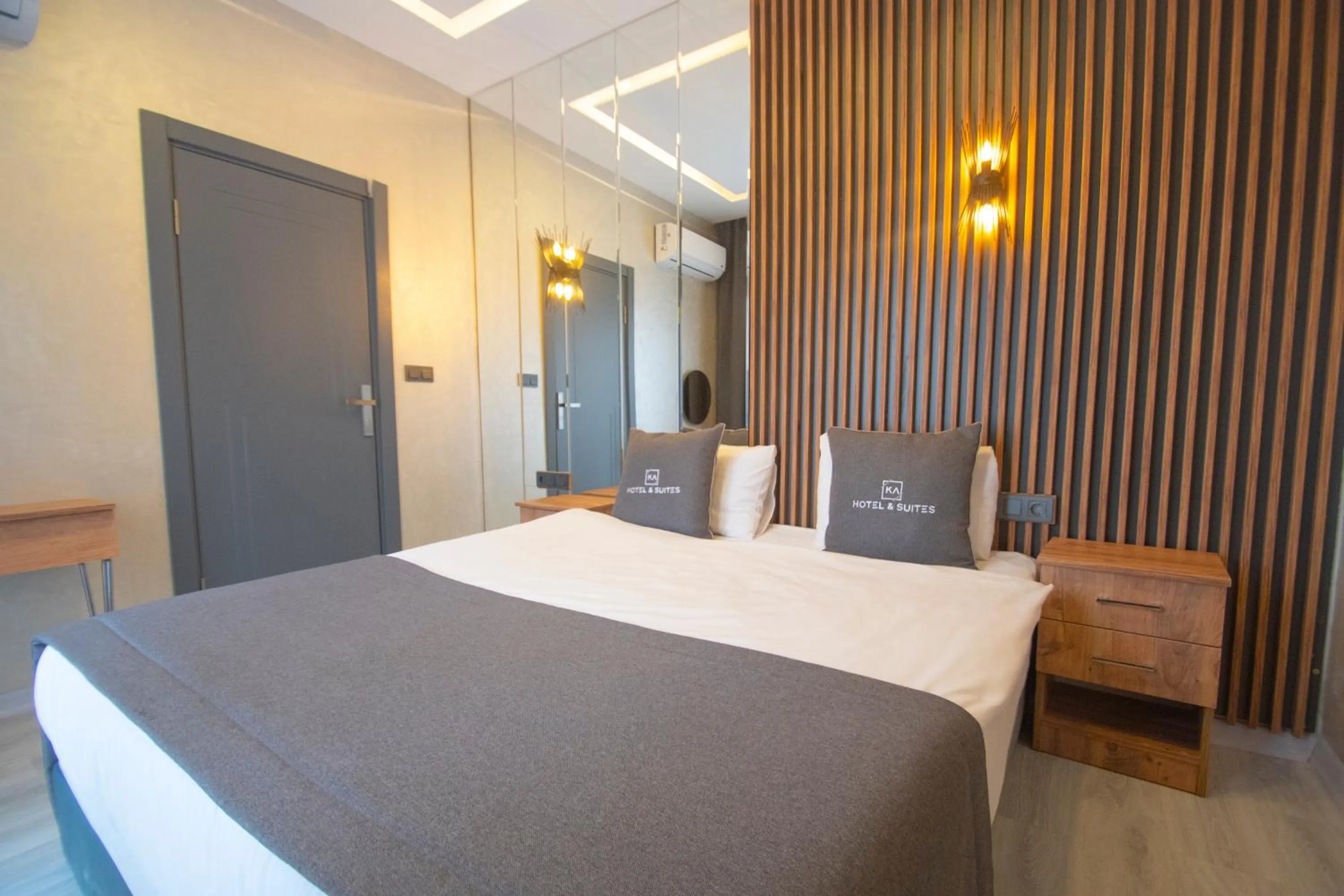 Bed in KA Hotel & Suites