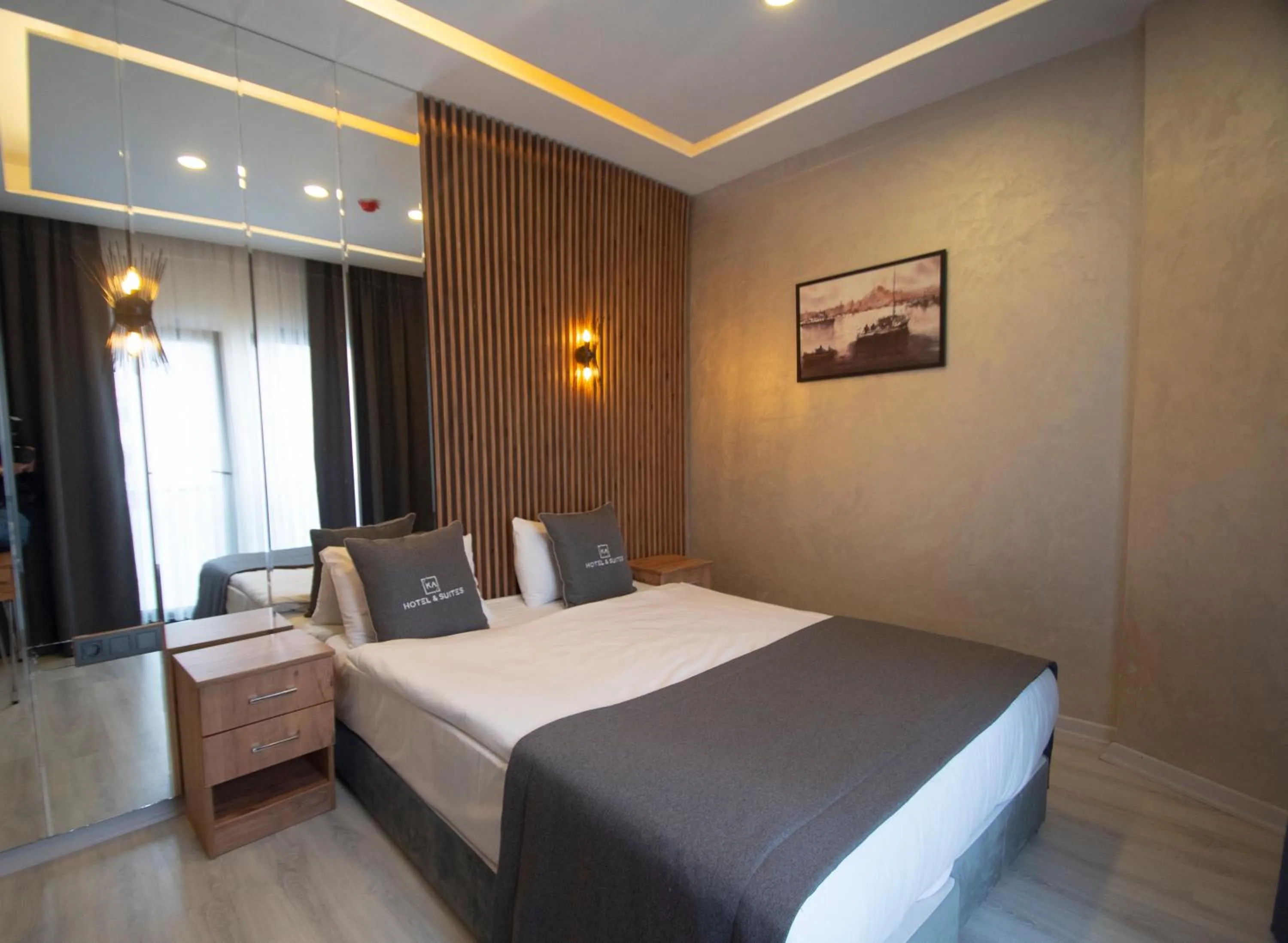Bed in KA Hotel & Suites