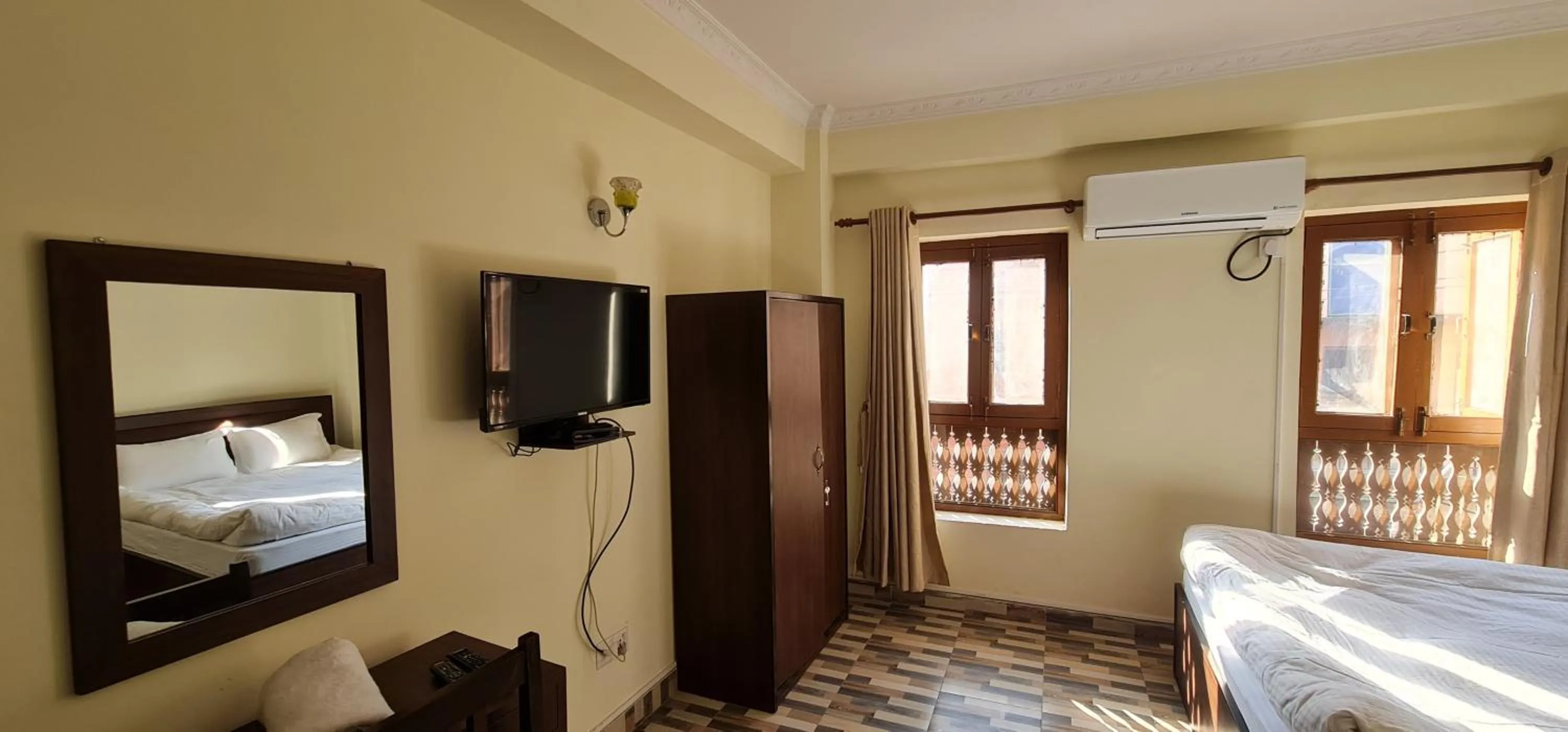 Communal lounge/ TV room, Bed in Pashupati View Hotel