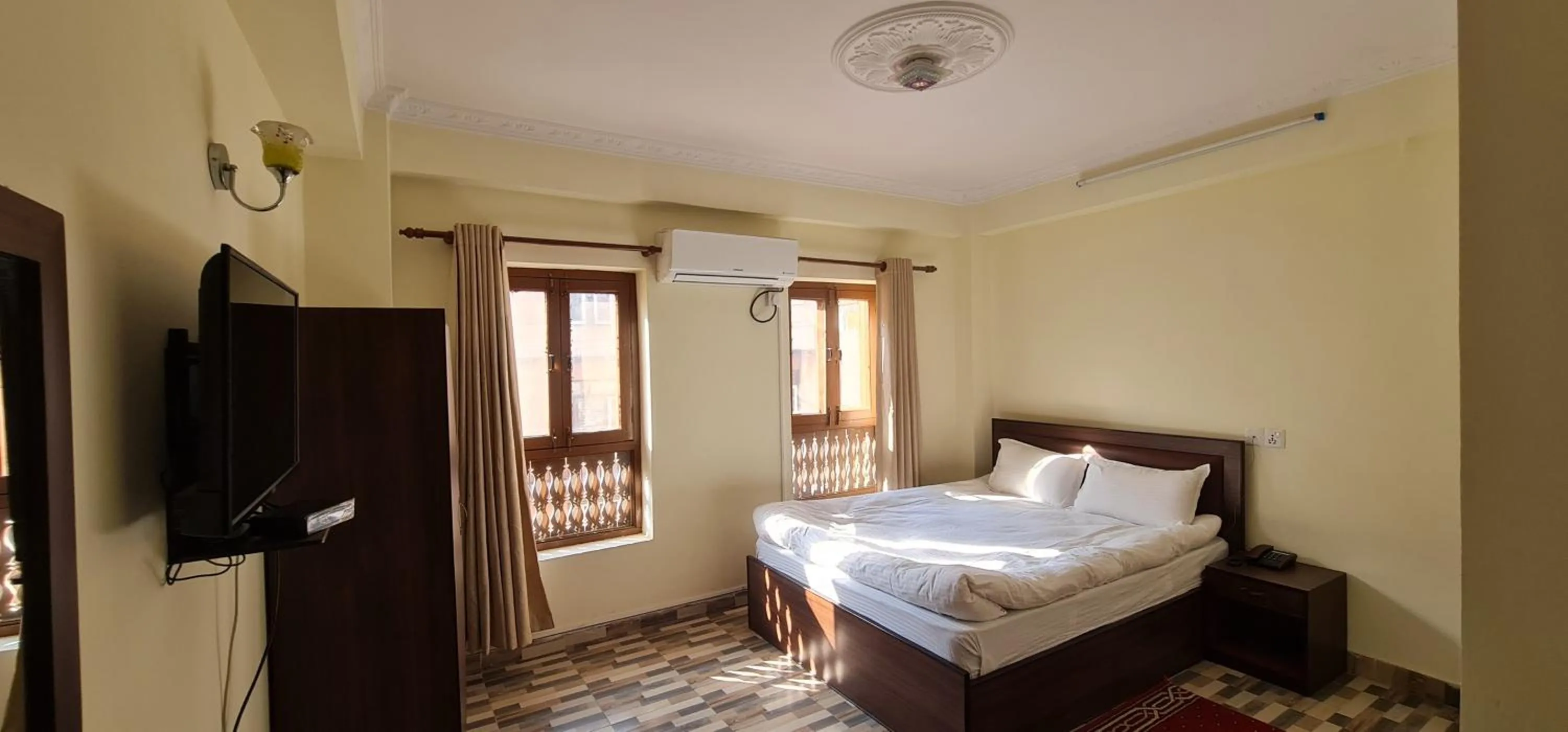 Communal lounge/ TV room, Bed in Pashupati View Hotel