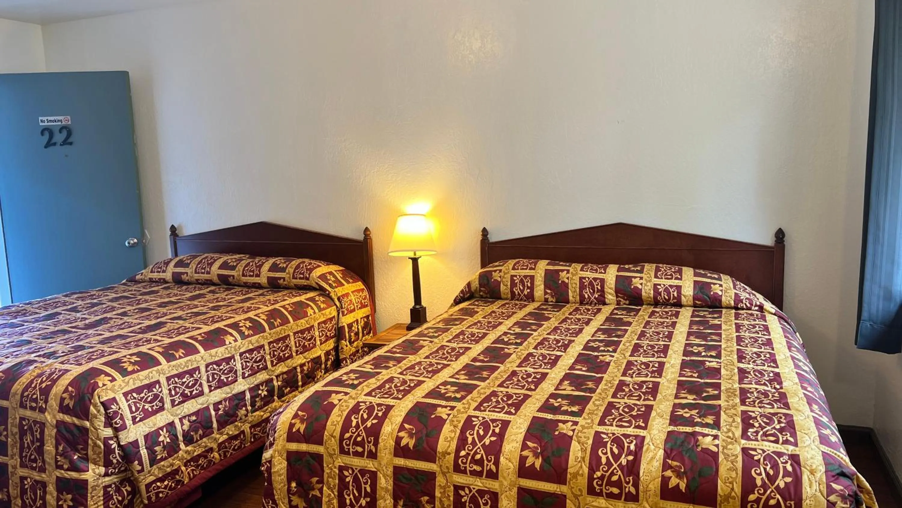 Bed in Pine Cone Motel