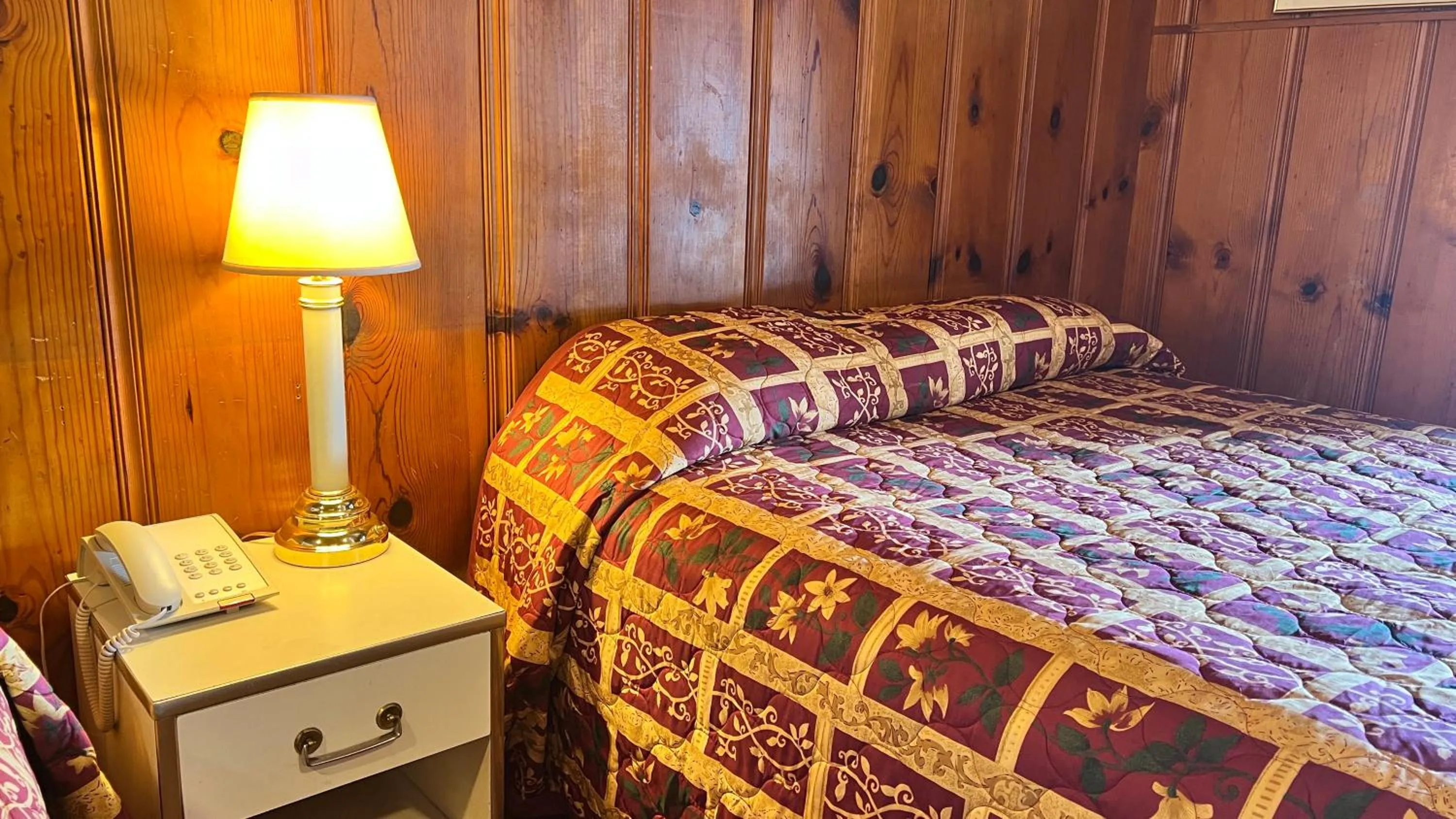 Bed in Pine Cone Motel
