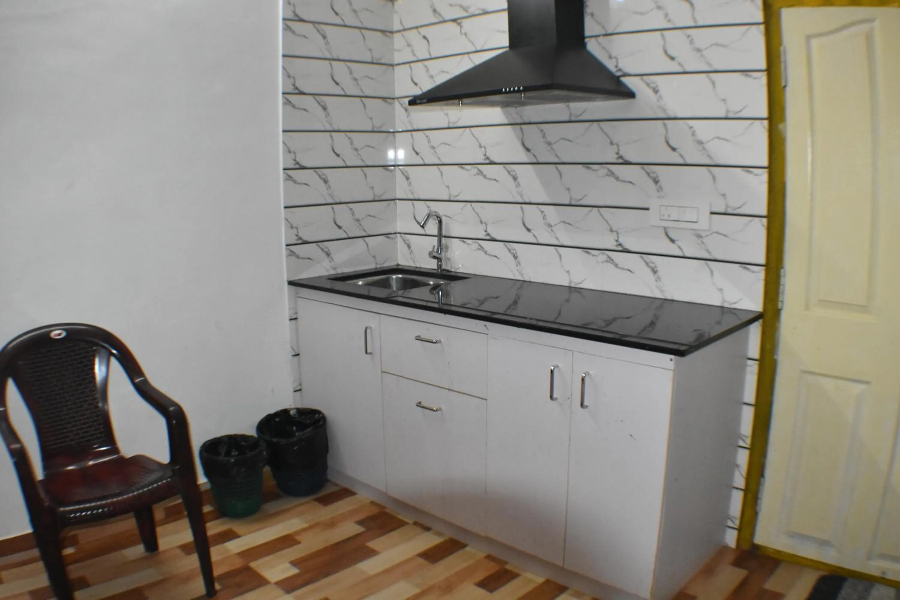 Kitchen or kitchenette in Ben's Villa Kannur !
