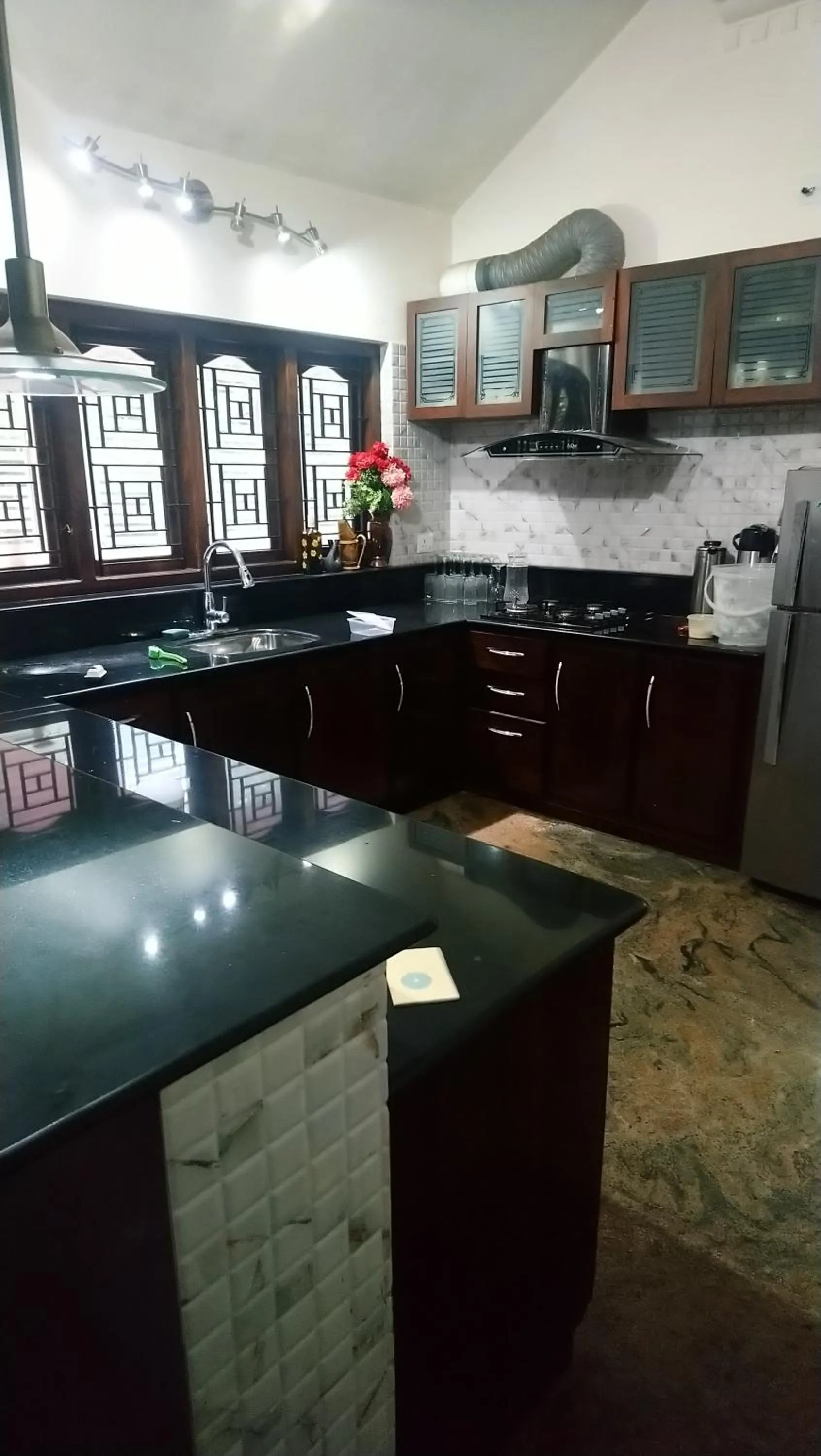 Kitchen or kitchenette in Ben's Villa Kannur !
