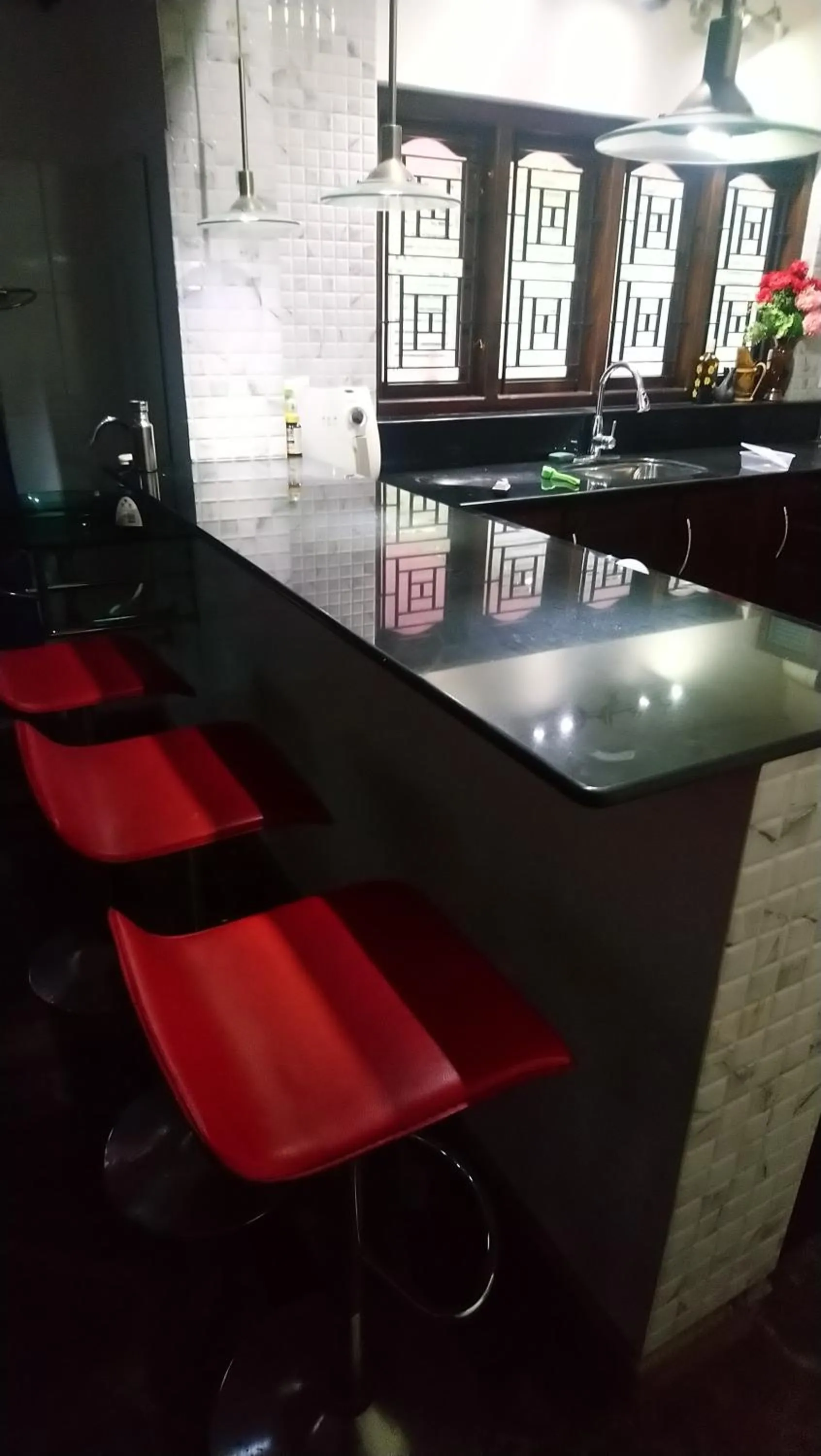 Kitchen or kitchenette in Ben's Villa Kannur !