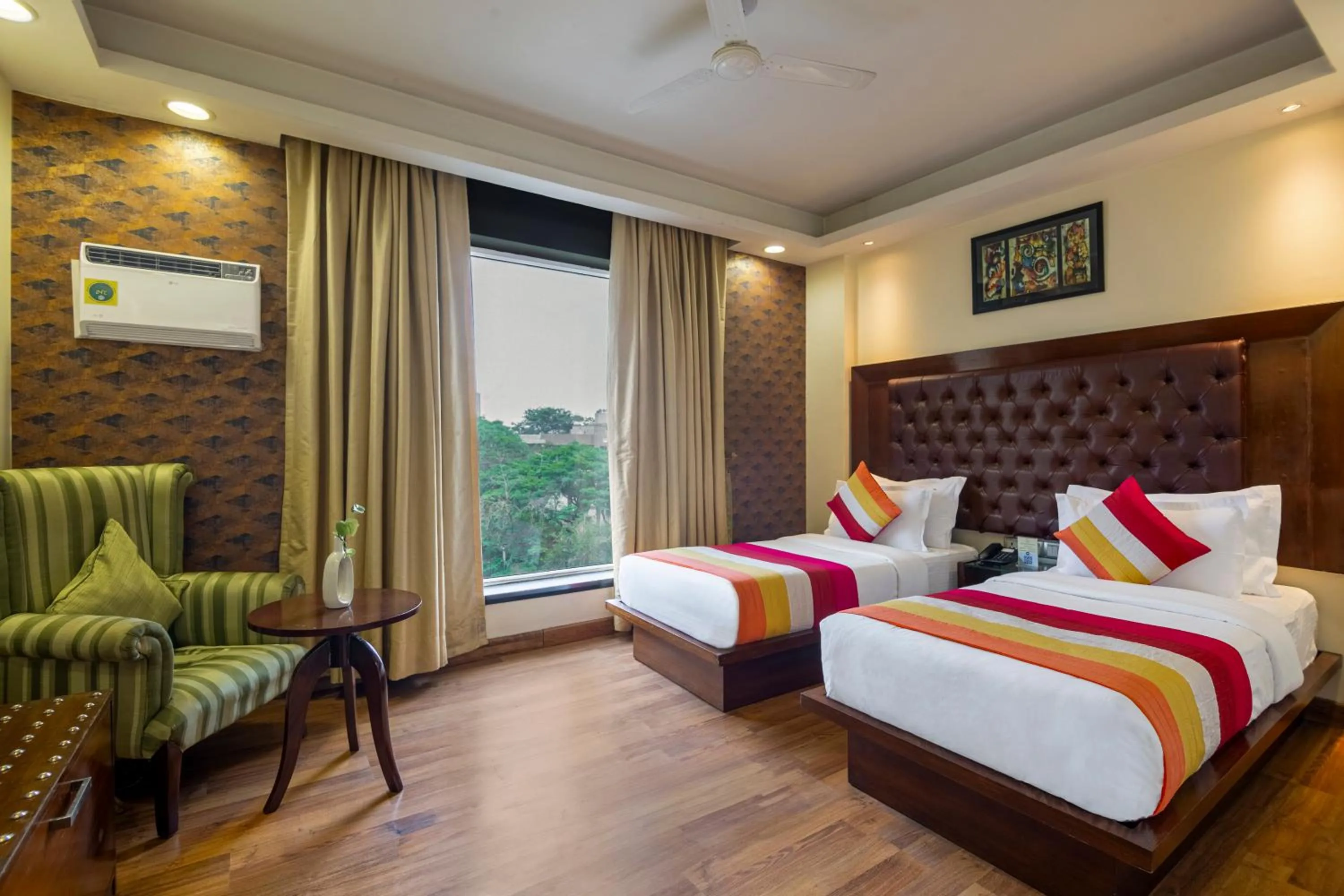 Bed in The Grand Orion - Kailash Colony