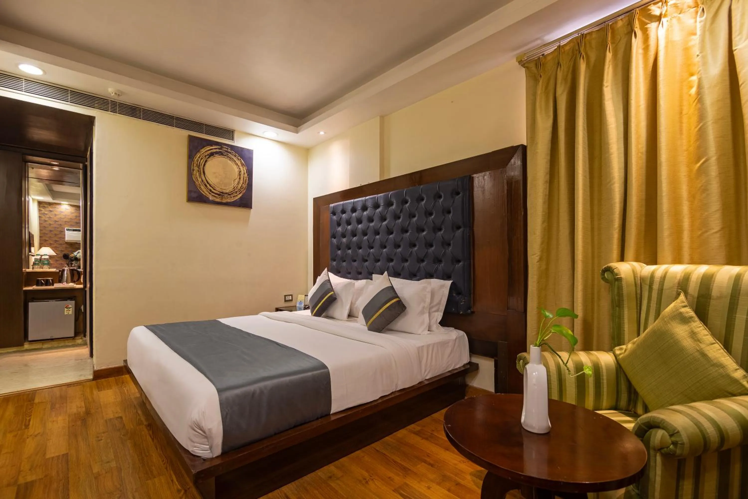 Bed in The Grand Orion - Kailash Colony