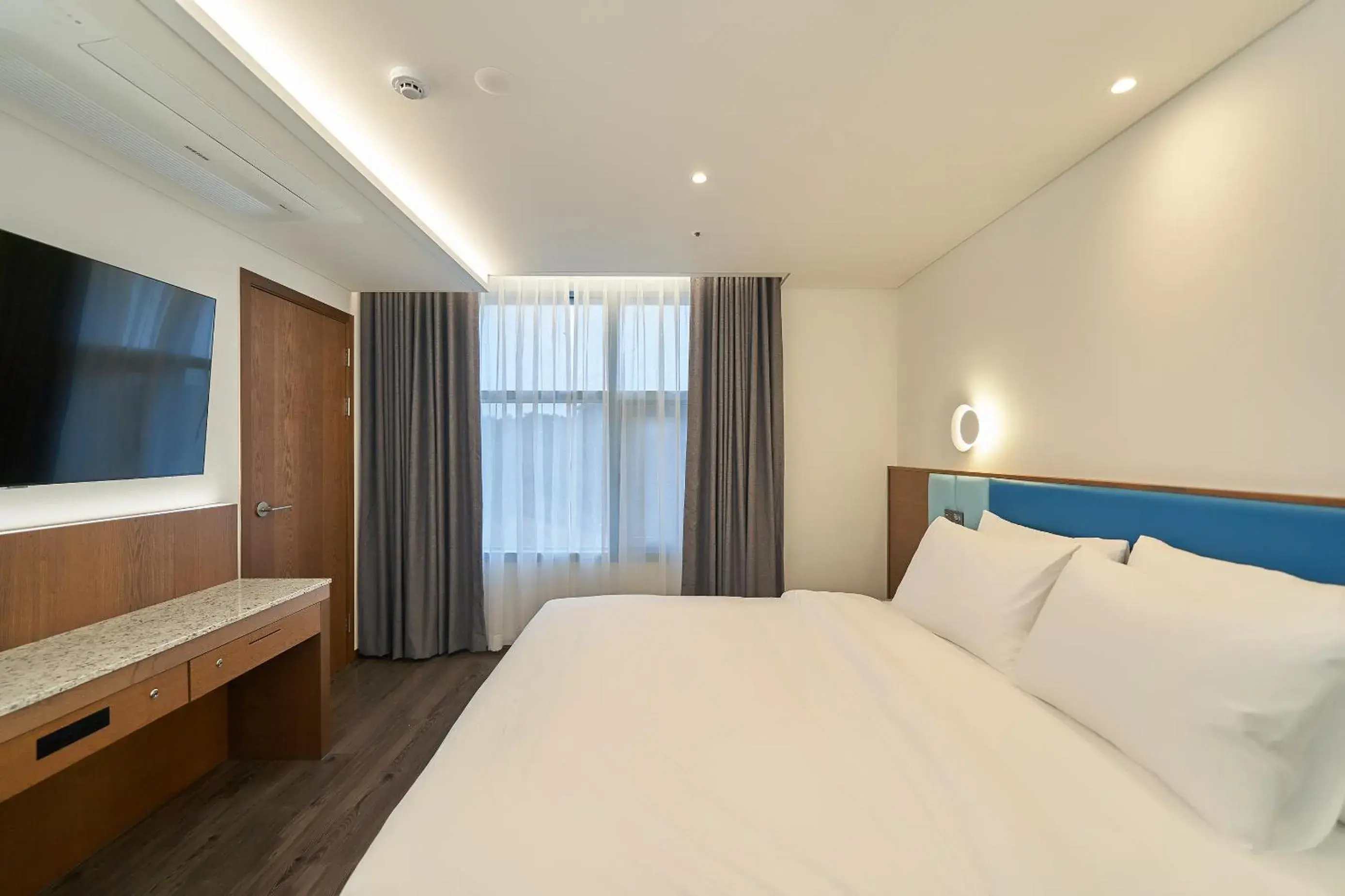 Bed in JN PARK Hotel Bed in JN PARK Hotel