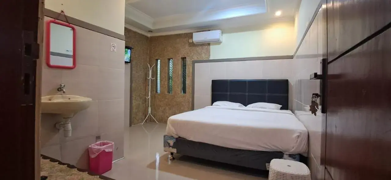 Bed in CALDERA PARK HOMESTAY Syariah Bed in CALDERA PARK HOMESTAY Syariah