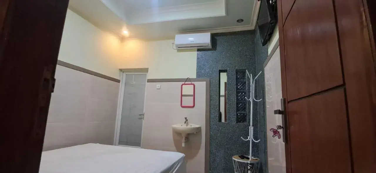 Bed in CALDERA PARK HOMESTAY Syariah Bed in CALDERA PARK HOMESTAY Syariah