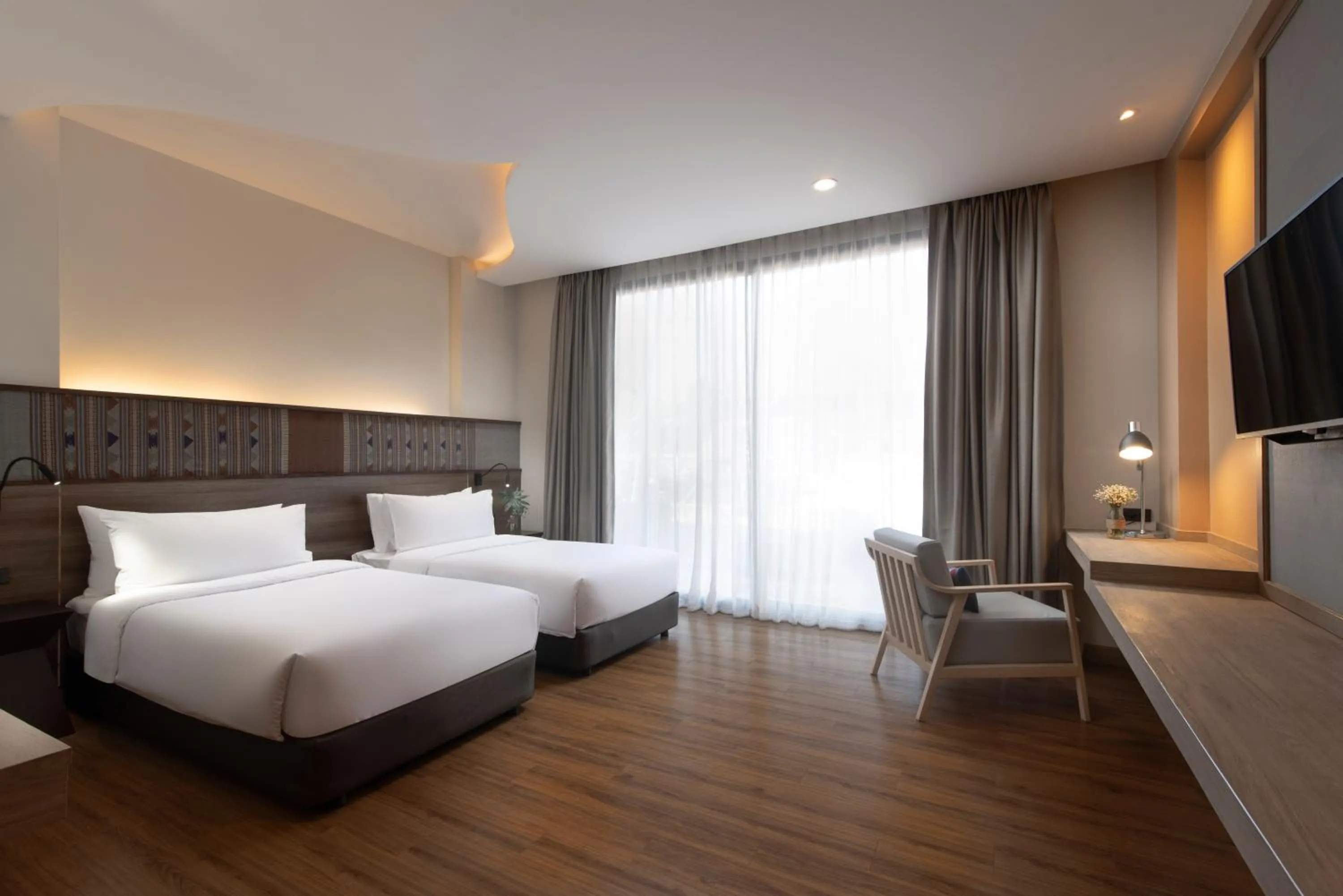 Bed in Emmaline Hotel Nan