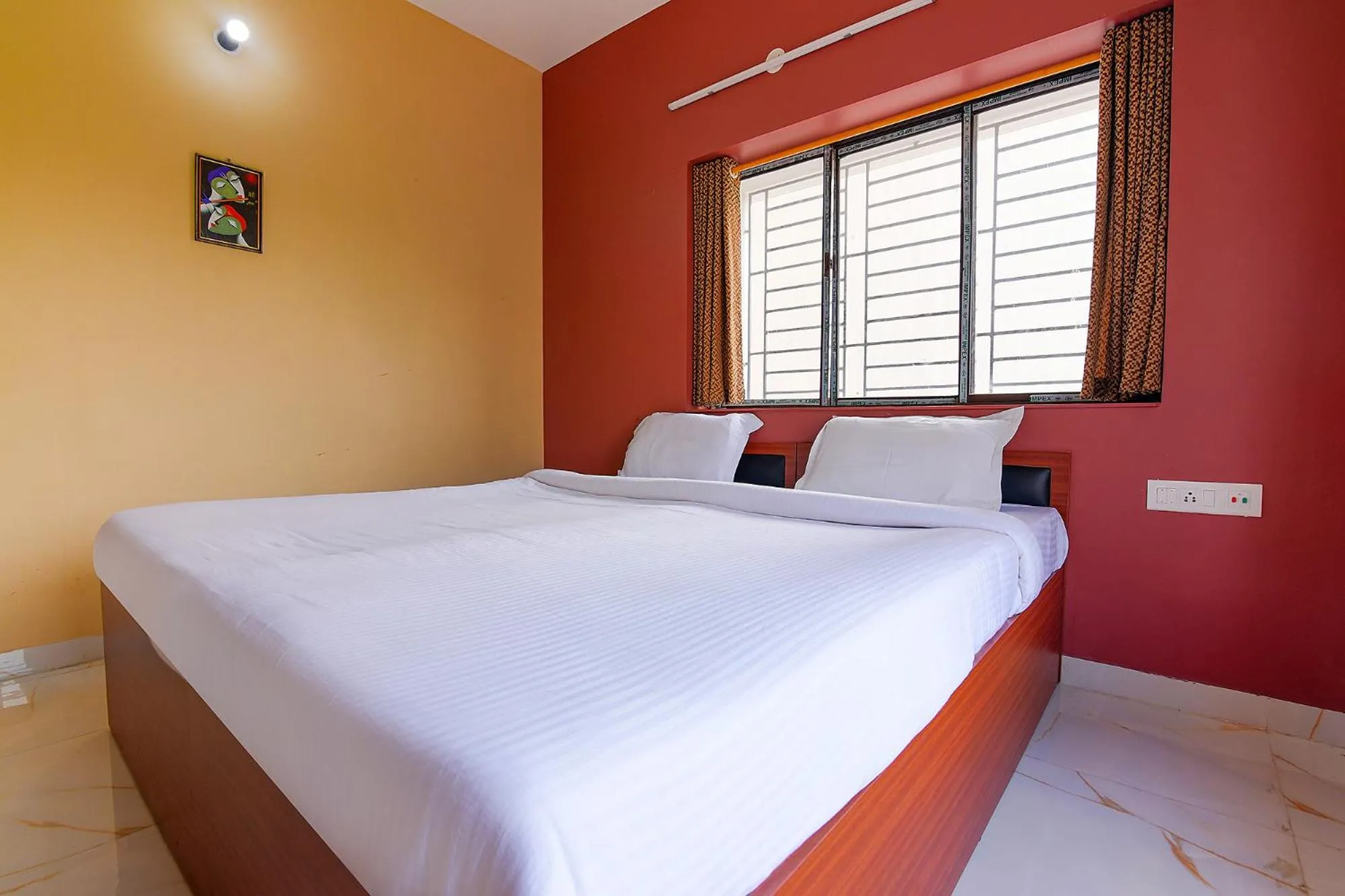 Bed in FabHotel Amar Raj Inn