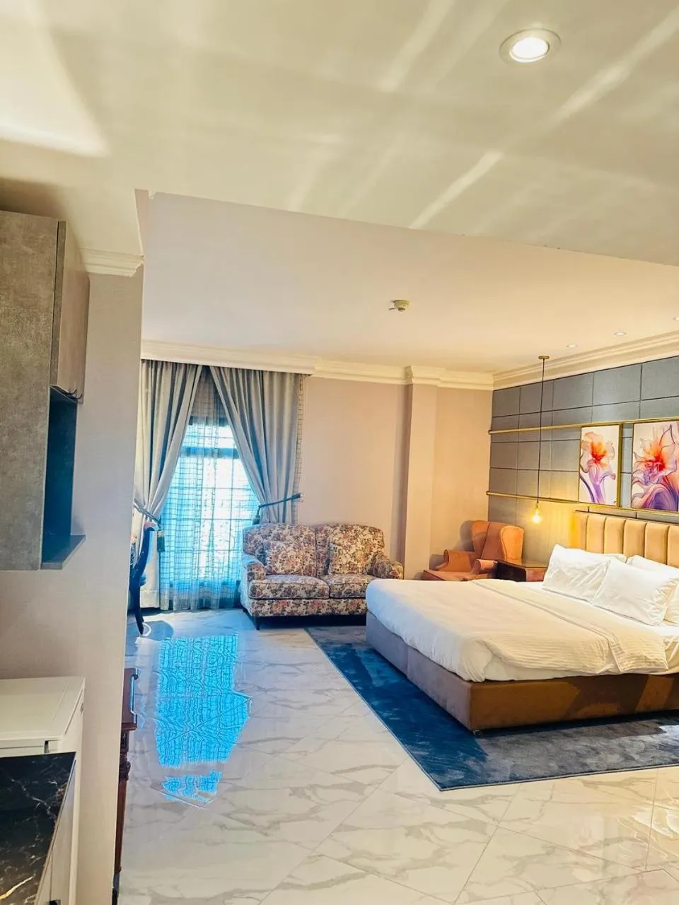 Bed in The Convention Center & Royal Suites Hotel