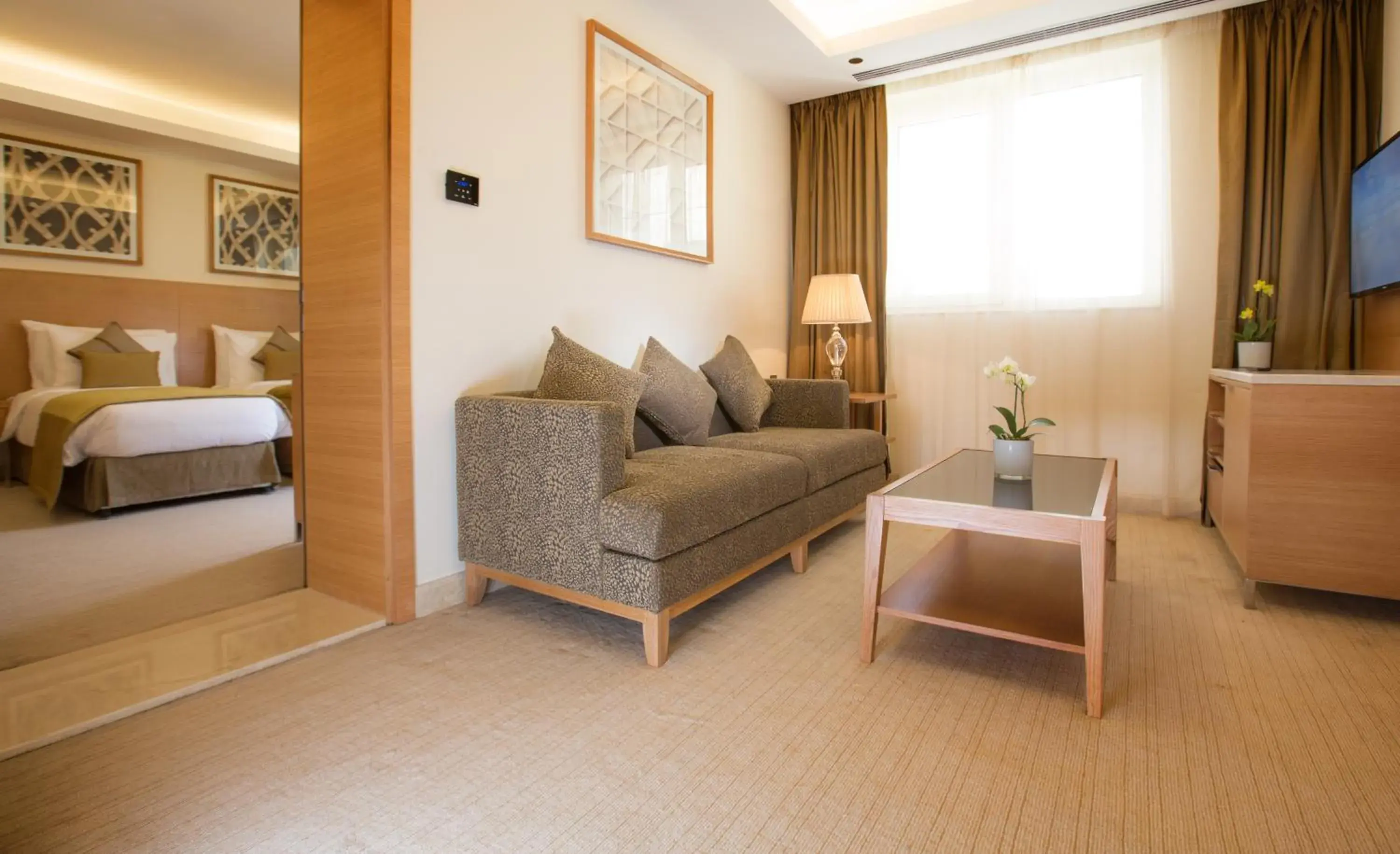 Seating area, Bed in Millennium Kurdistan Hotel & Spa Seating area, Bed in Millennium Kurdistan Hotel & Spa