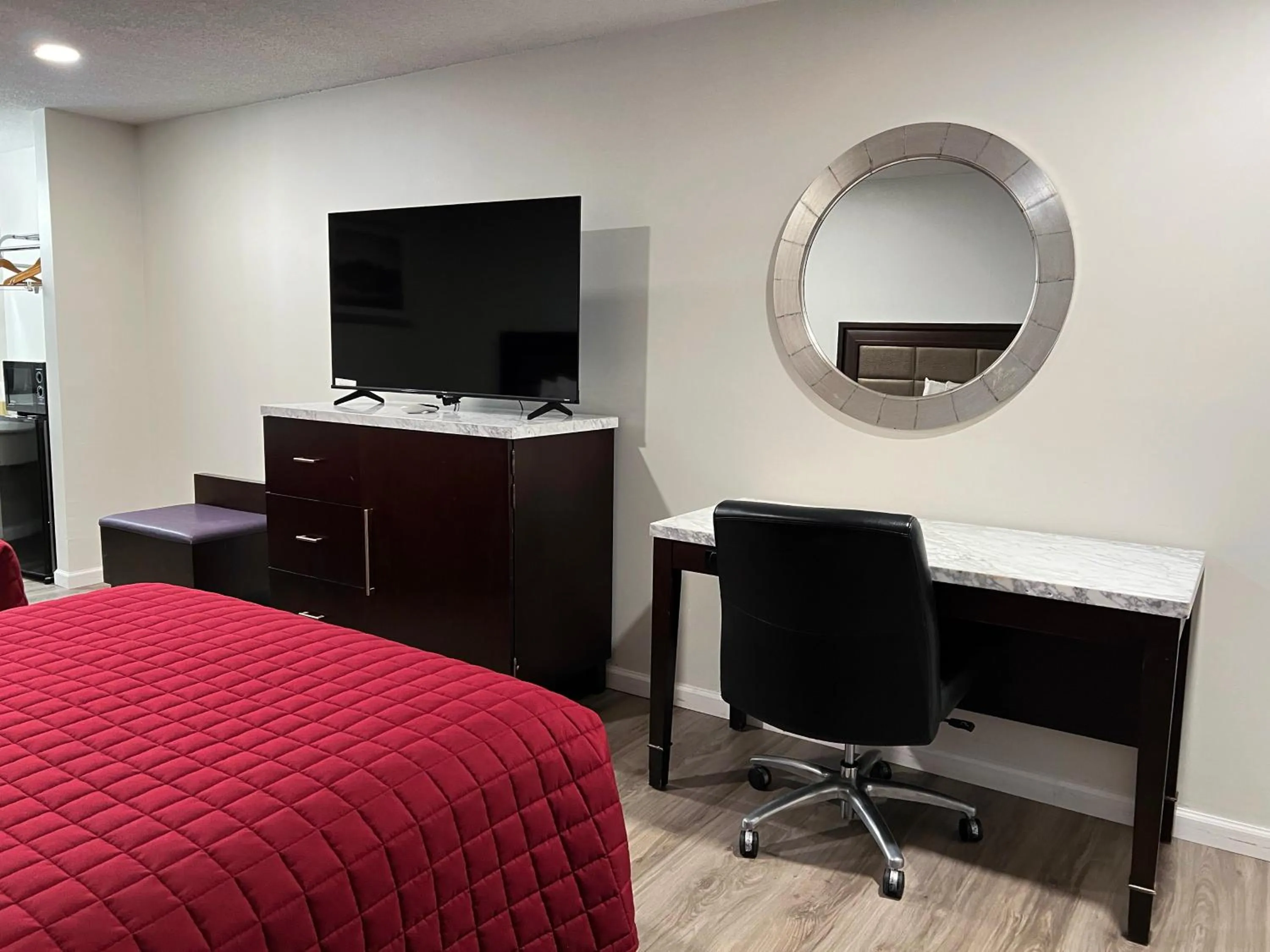 Bed in Garden Inn & Suites