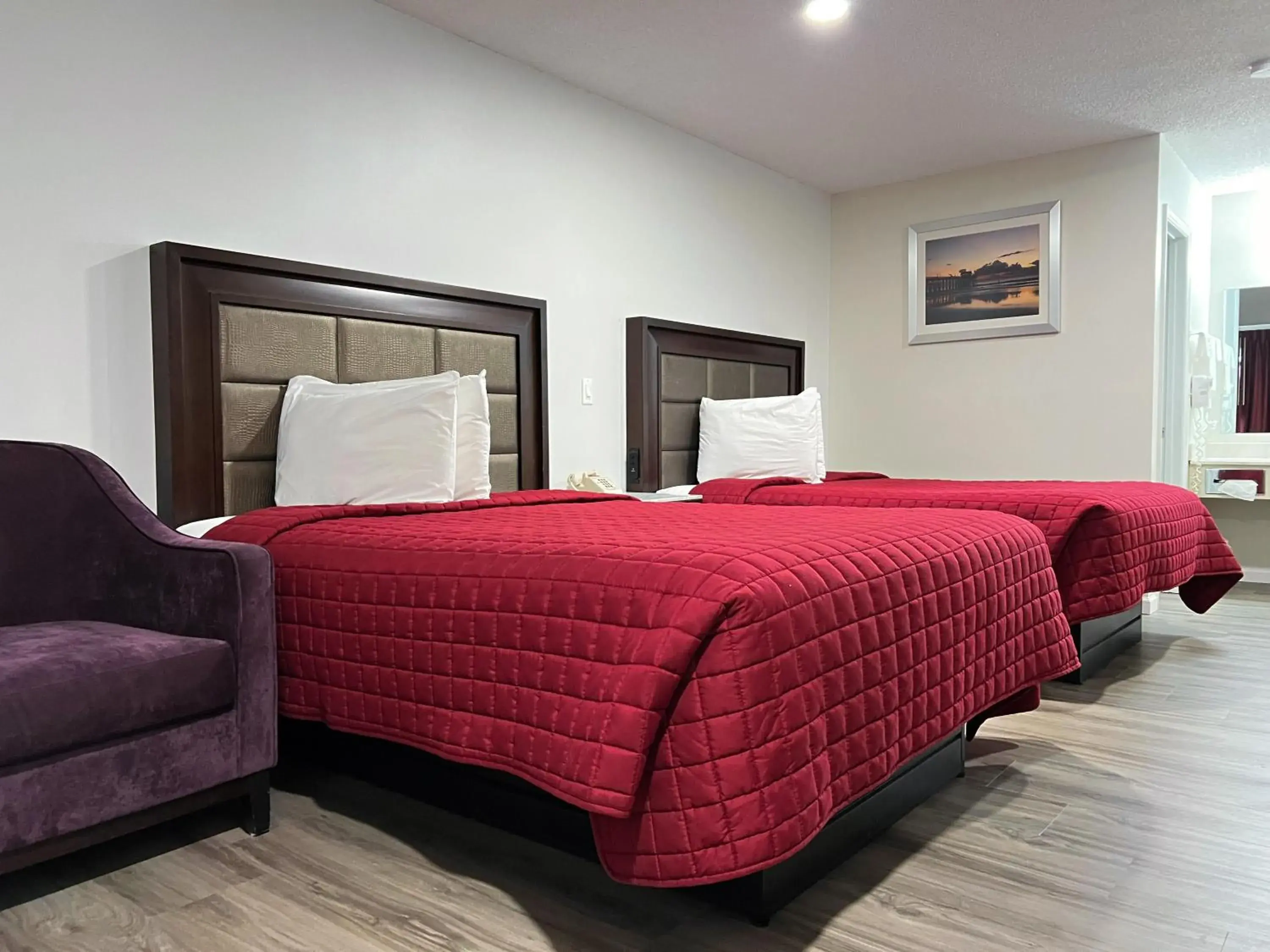 Bed in Garden Inn & Suites Bed in Garden Inn & Suites