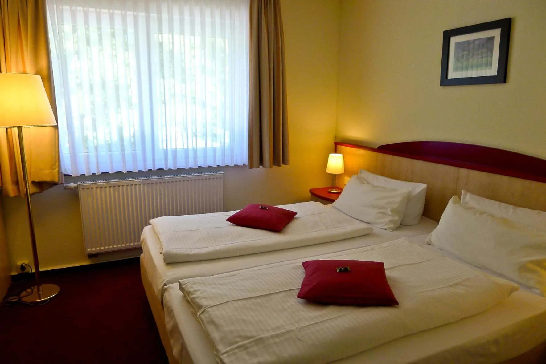 Photo of the whole room, Bed in Seehotel Weit Meer