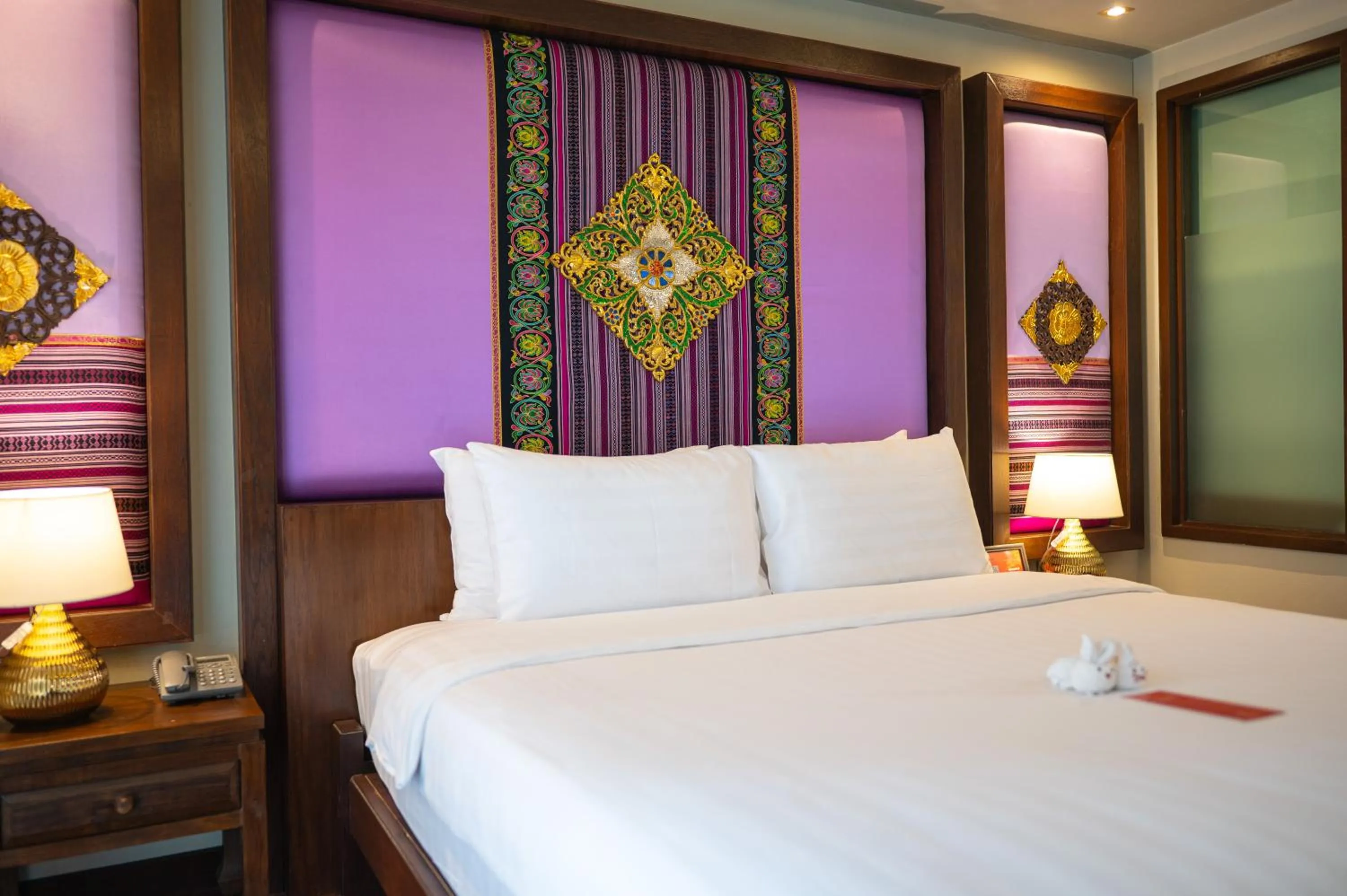 Bed in At Gate Thaphae Hotel