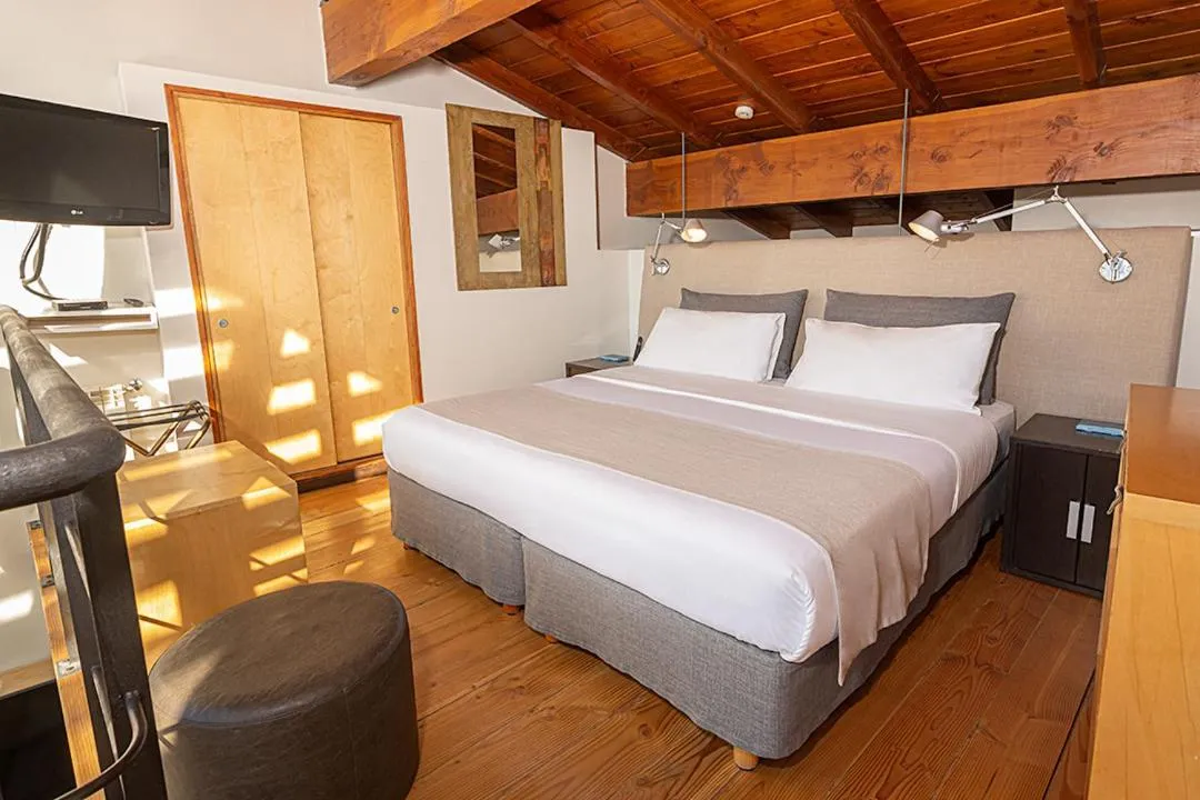 Bedroom, Bed in Rochester Bariloche Suites & Spa