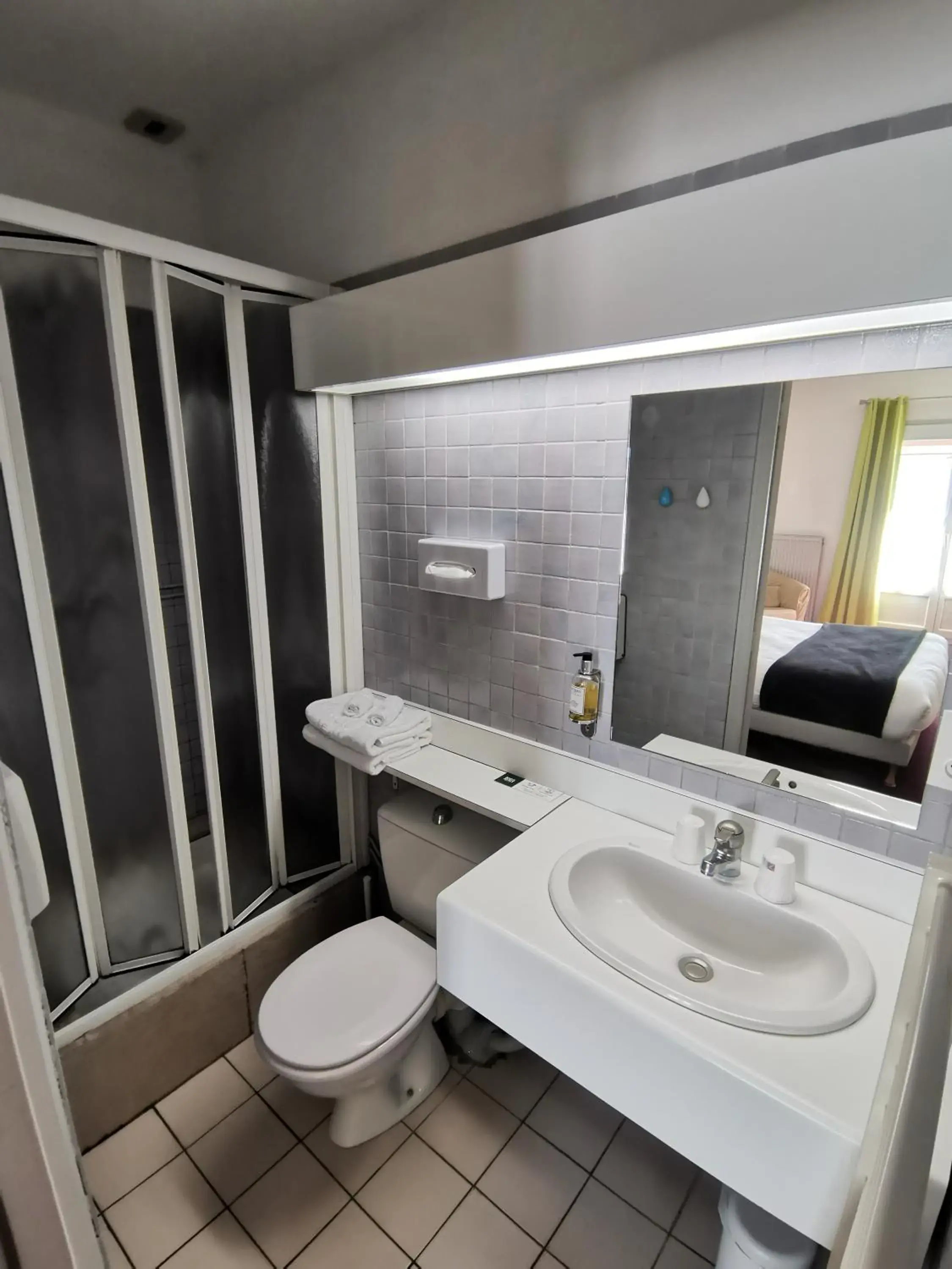 Inner courtyard view in Logis Hotel Le Cerf Inner courtyard view in Logis Hotel Le Cerf