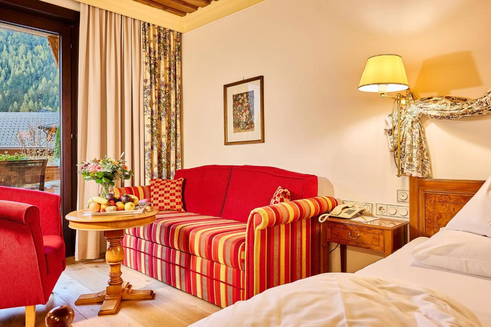 Seating area, Bed in Thermenwelt Hotel Pulverer