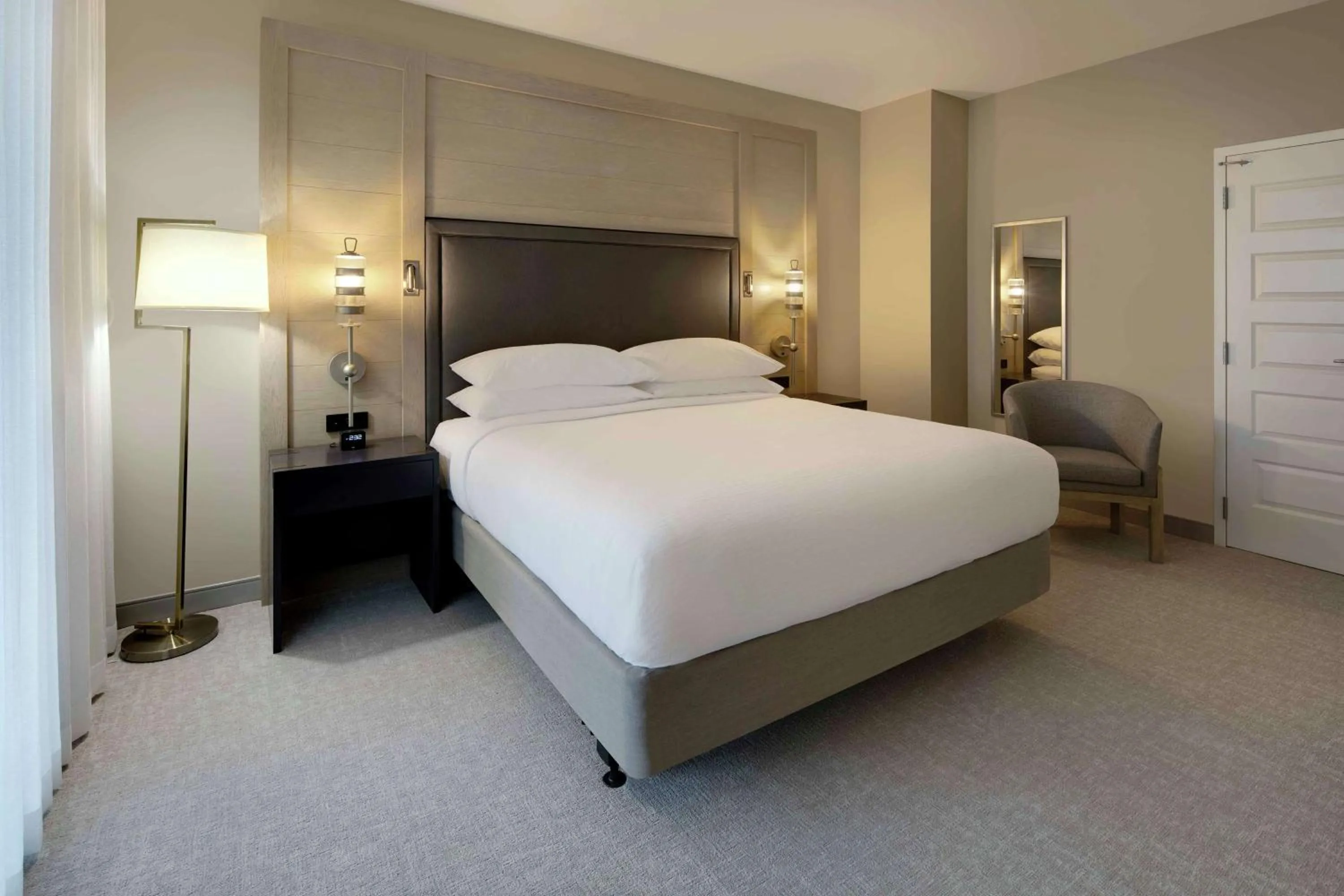 Living room, Bed in Embassy Suites St Augustine Beach Oceanfront Resort