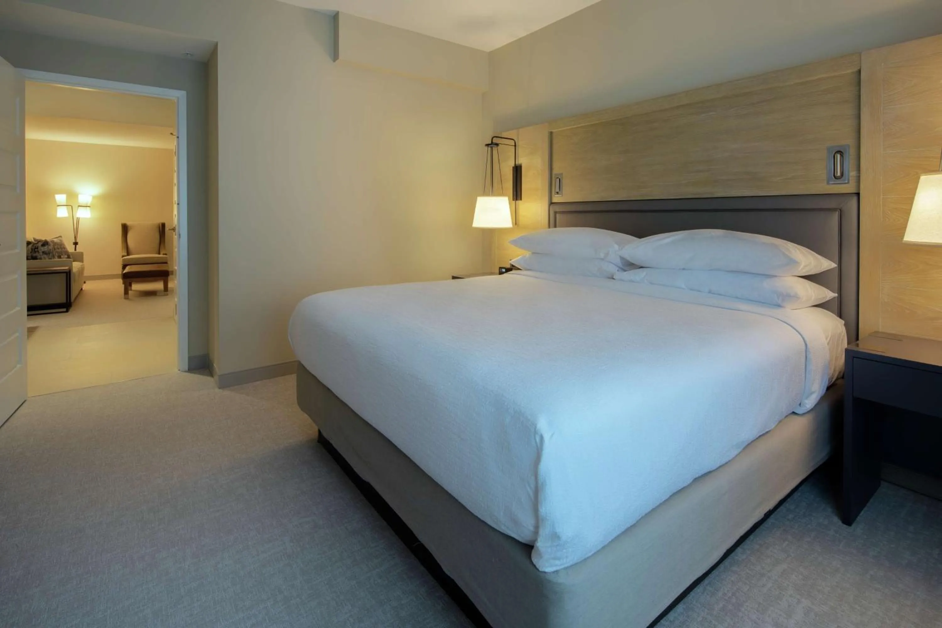Living room, Bed in Embassy Suites St Augustine Beach Oceanfront Resort