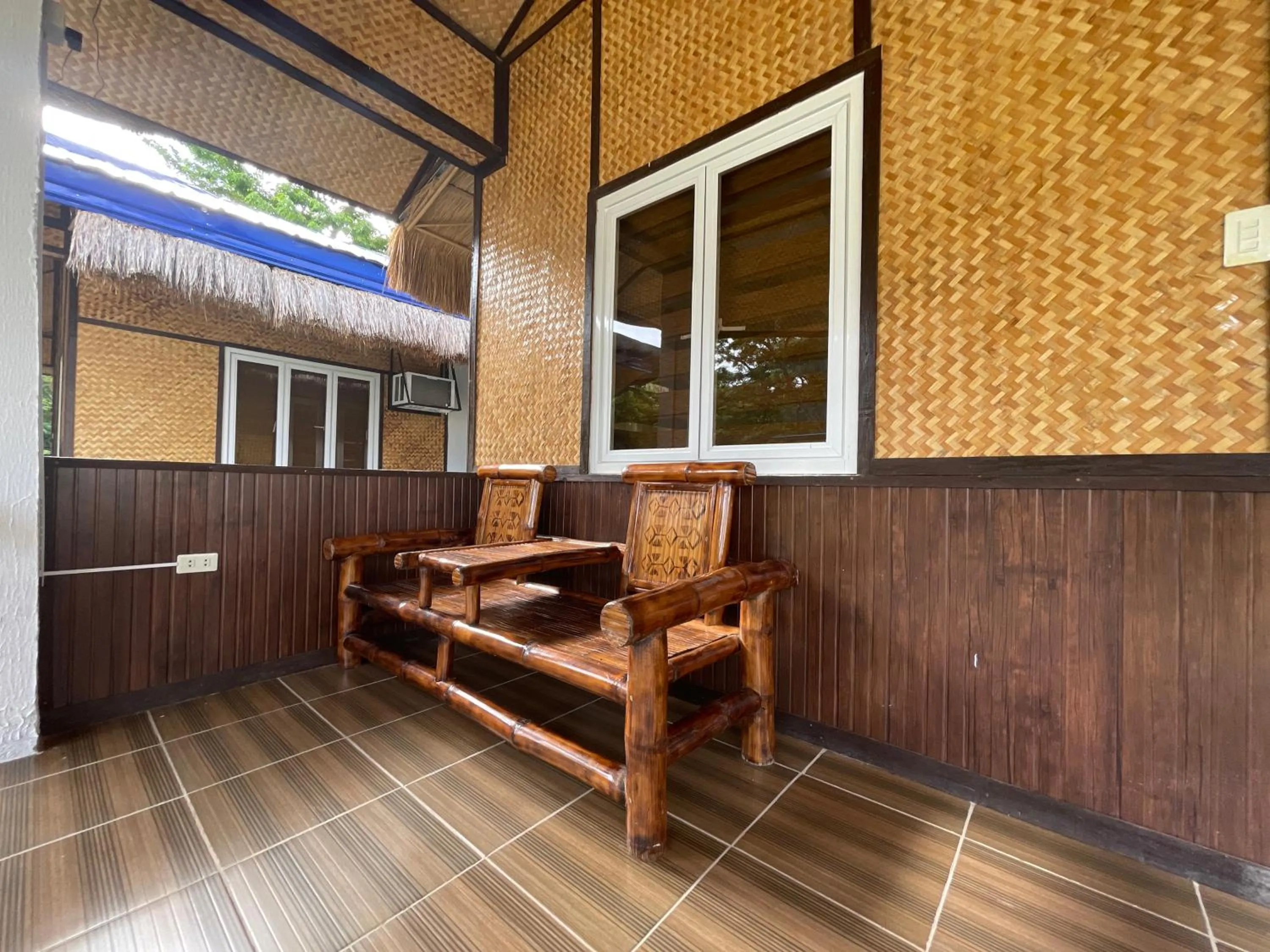 Seating area in LaSersita Casitas and Water Spa Beach Resort by Cocotel