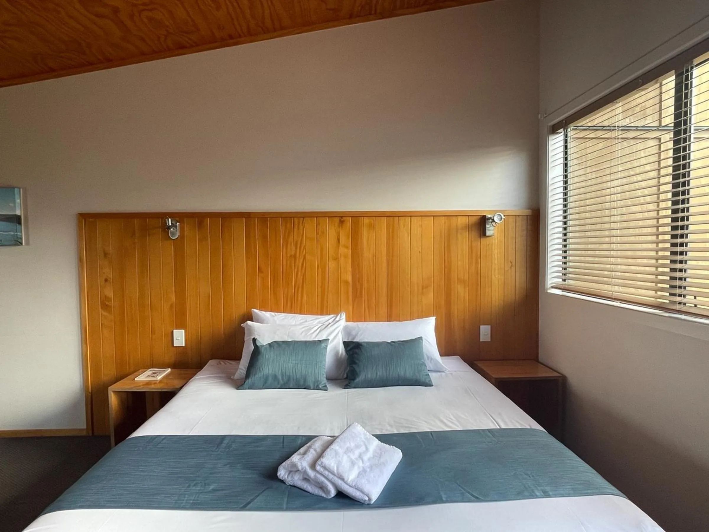 Bed in Waitomo Lodge