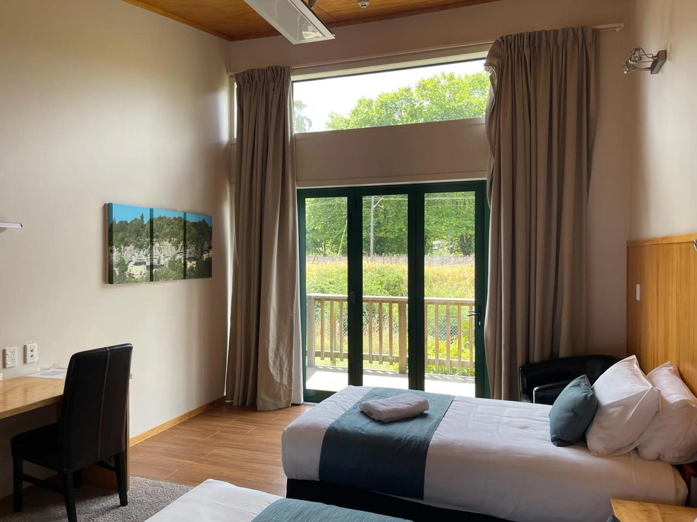 Bed in Waitomo Lodge