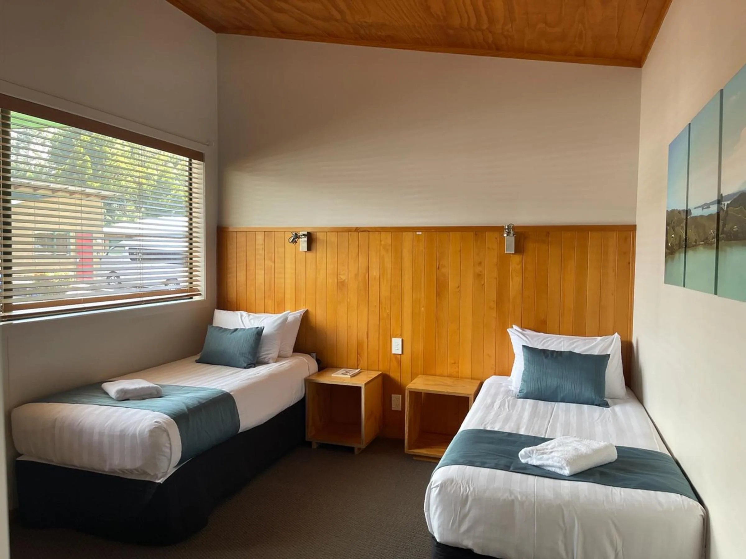 Bed in Waitomo Lodge