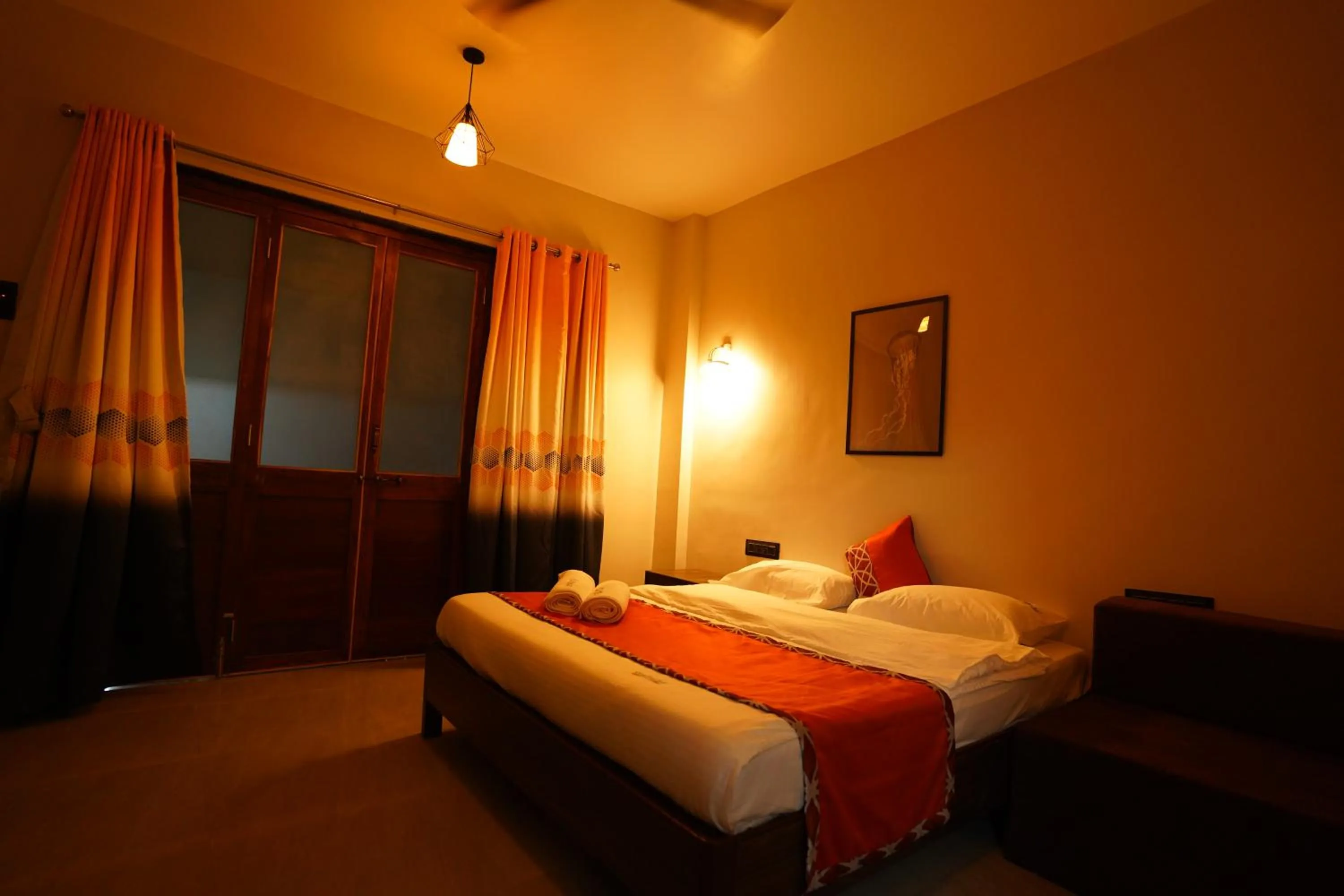 Bed in Coastal Bay Inn by Green Apple Stays