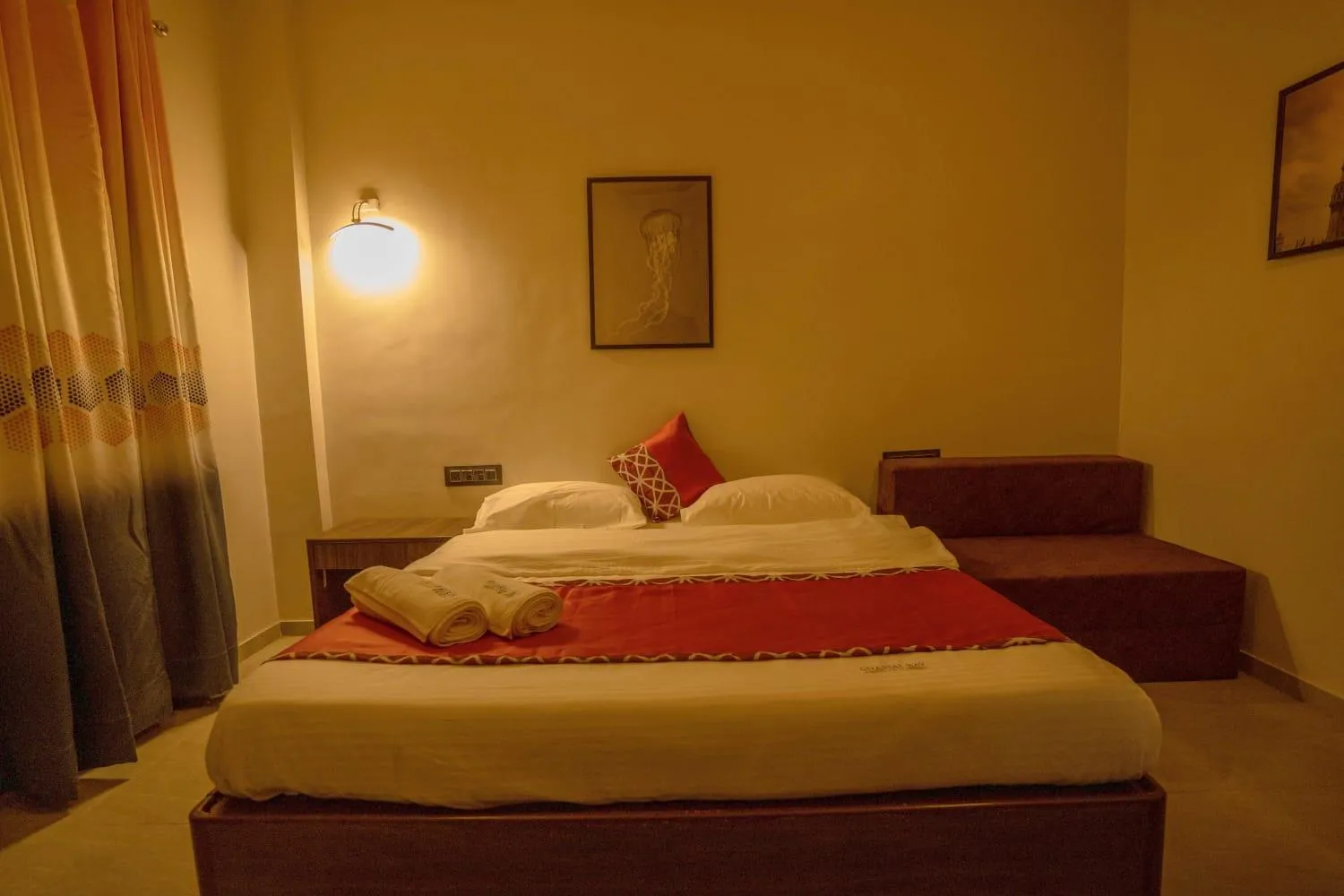 Bed in Coastal Bay Inn by Green Apple Stays