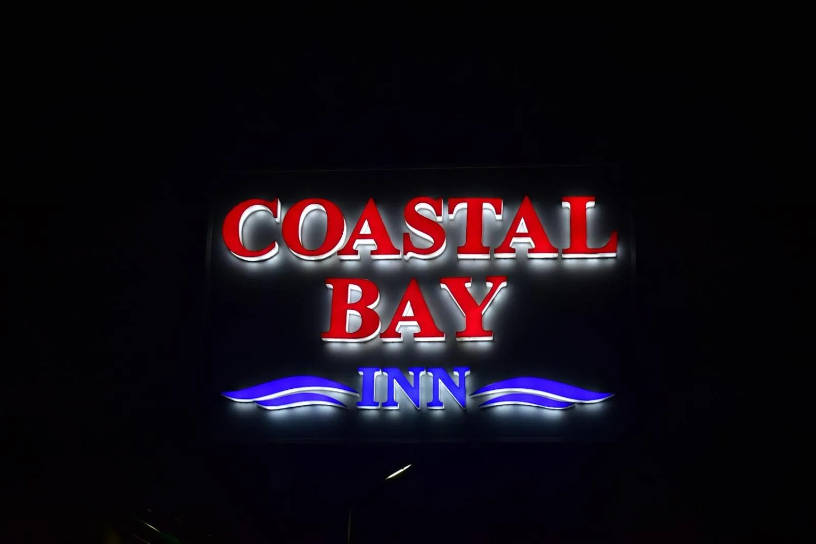 Property building in Coastal Bay Inn by Green Apple Stays