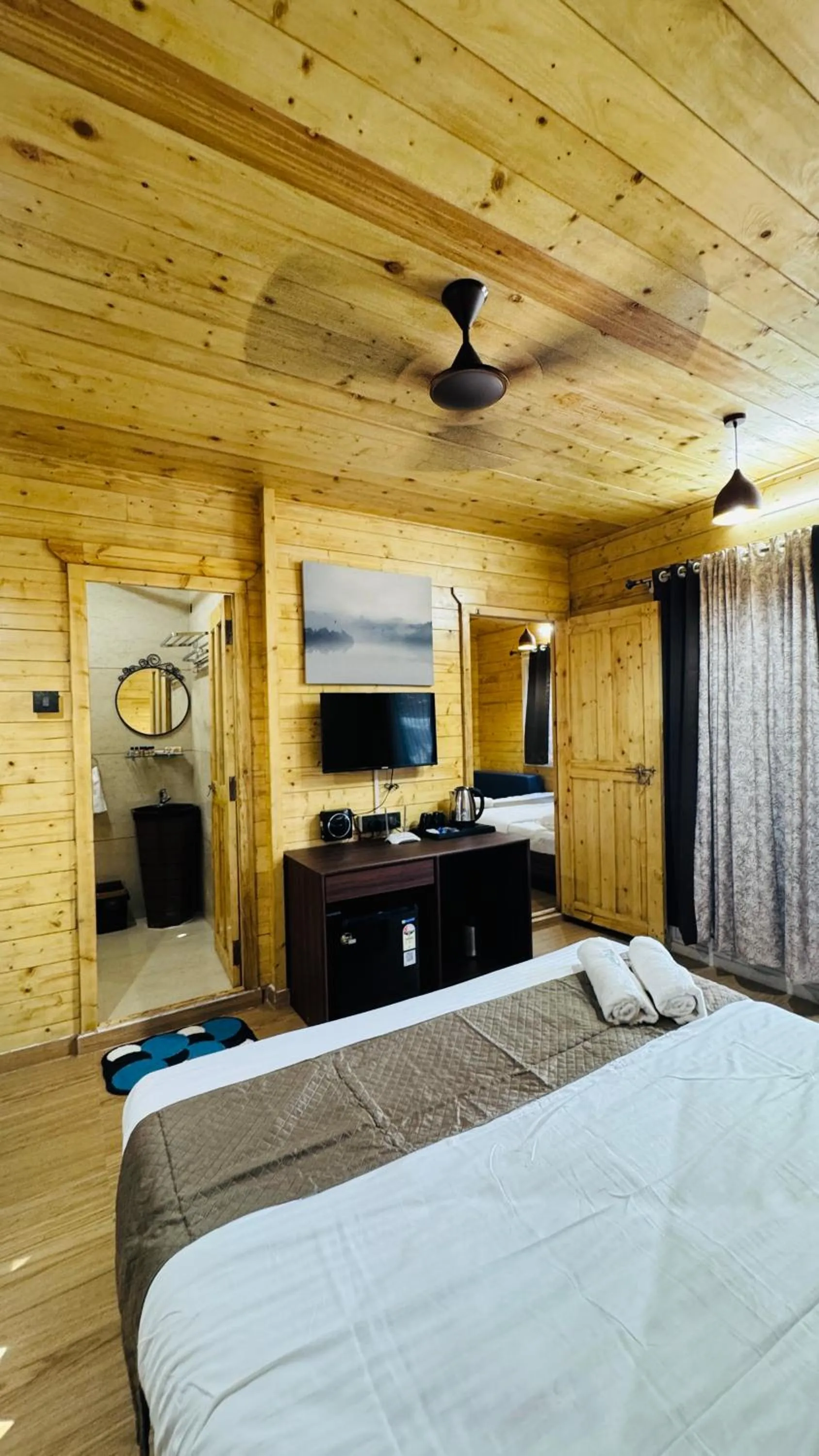 Bed in Coastal Bay Inn by Green Apple Stays