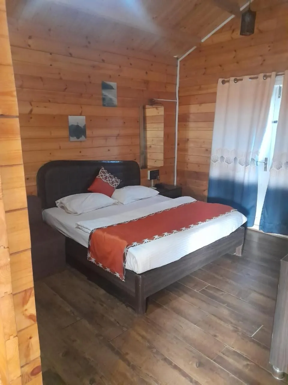 Bed in Coastal Bay Inn by Green Apple Stays