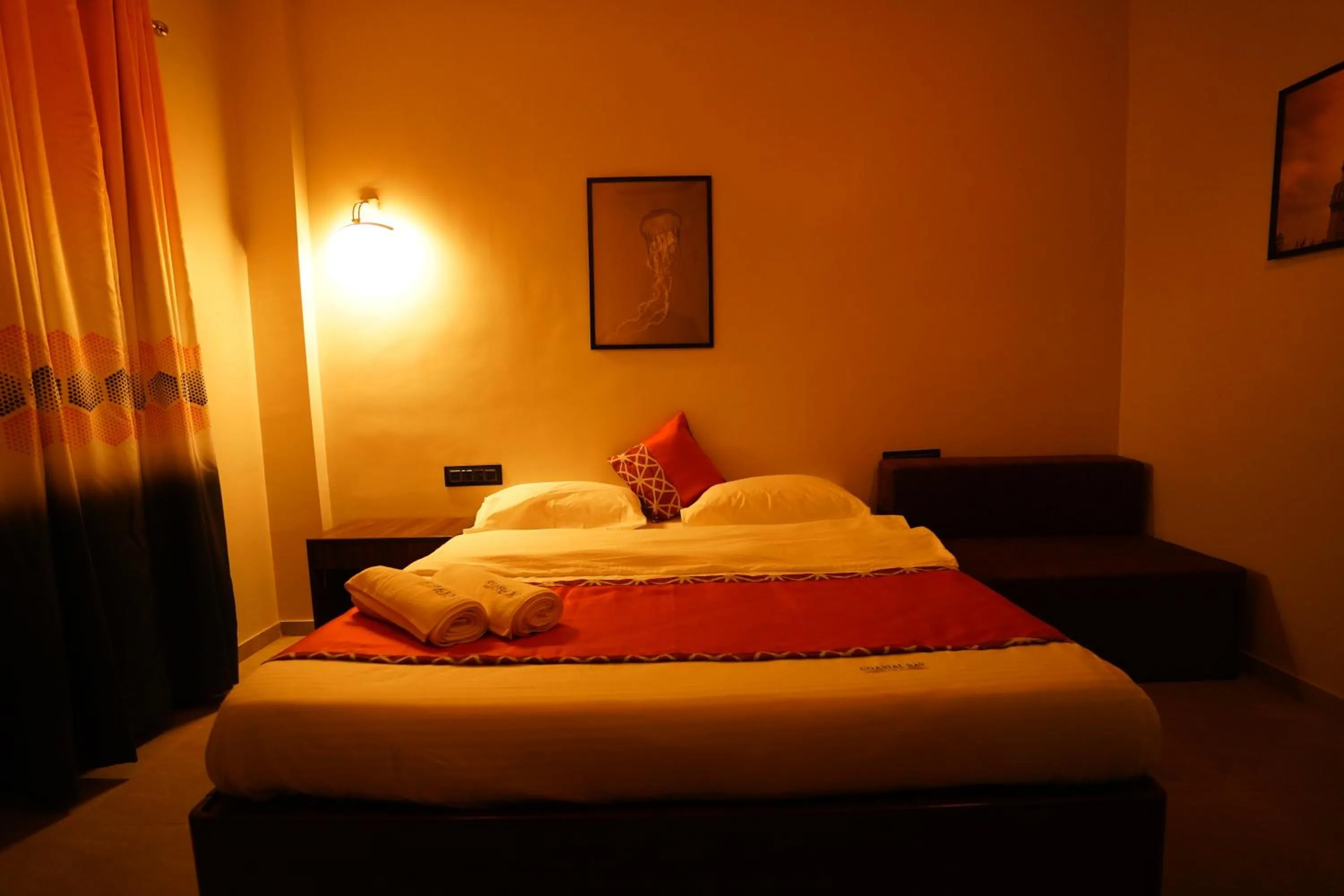 Bed in Coastal Bay Inn by Green Apple Stays