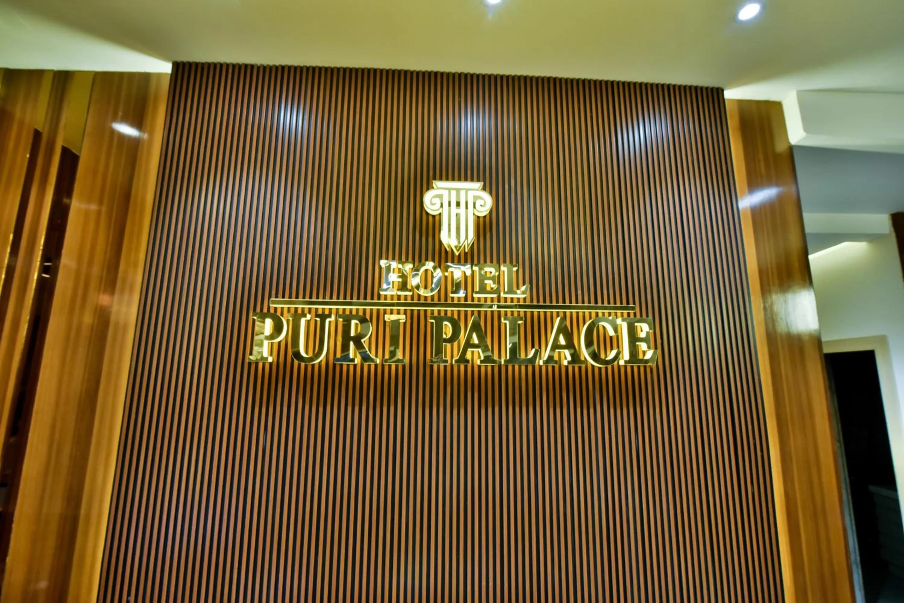 Property logo or sign in Hotel Puri Palace